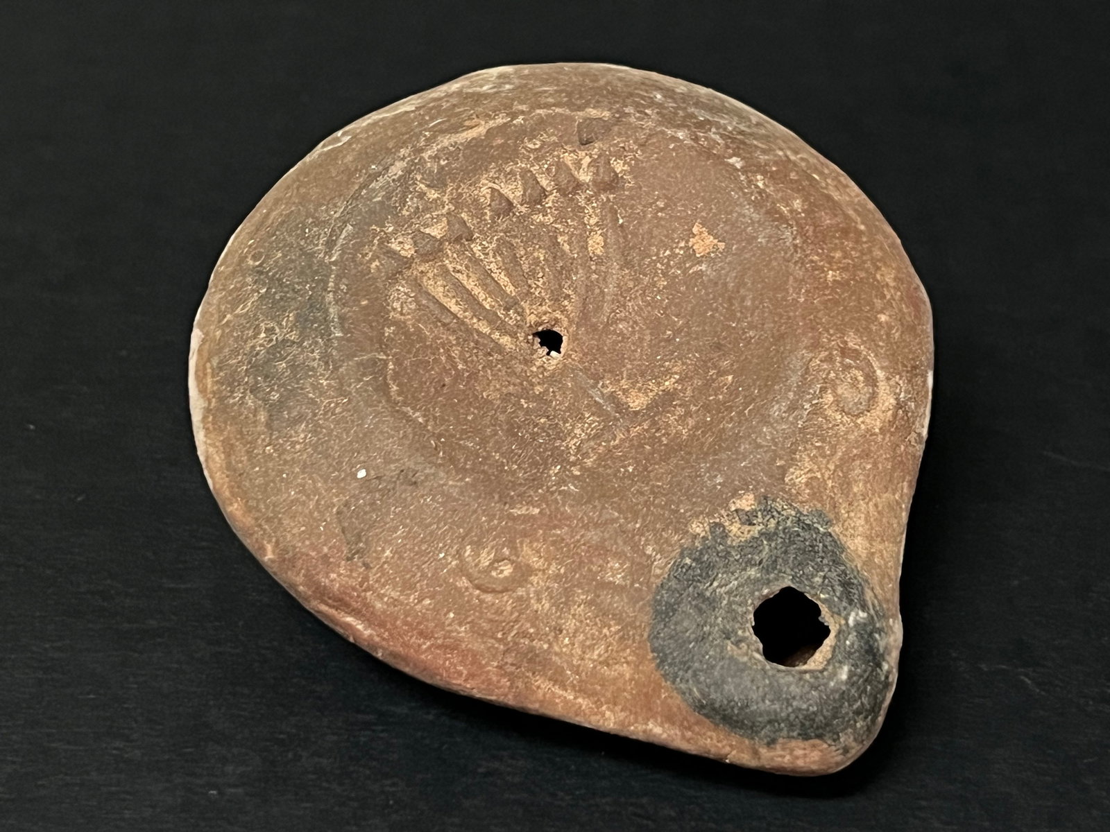 Terre Cotta Oil Lamp: Terra Cotta Oil Lamp. The dimension is 1 inches high x 2 inches wide. Please be aware that some of the items are vintage, secondhand, old ages, antiques and may have a defects or sign of ages, However