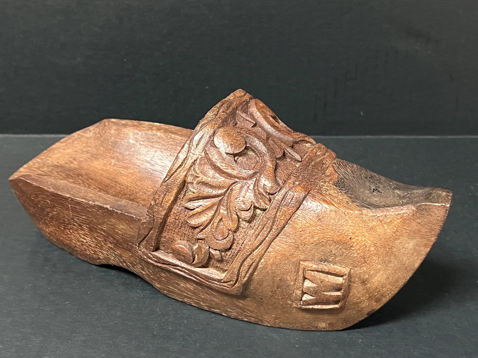Carved Wood Shoe with Floral Design: Folk Art Carved Wood Shoe with Floral Design. The dimension is 6 inches high x 12 inches wide. Please be aware that some of the items are vintage, secondhand, old ages, antiques and may have a