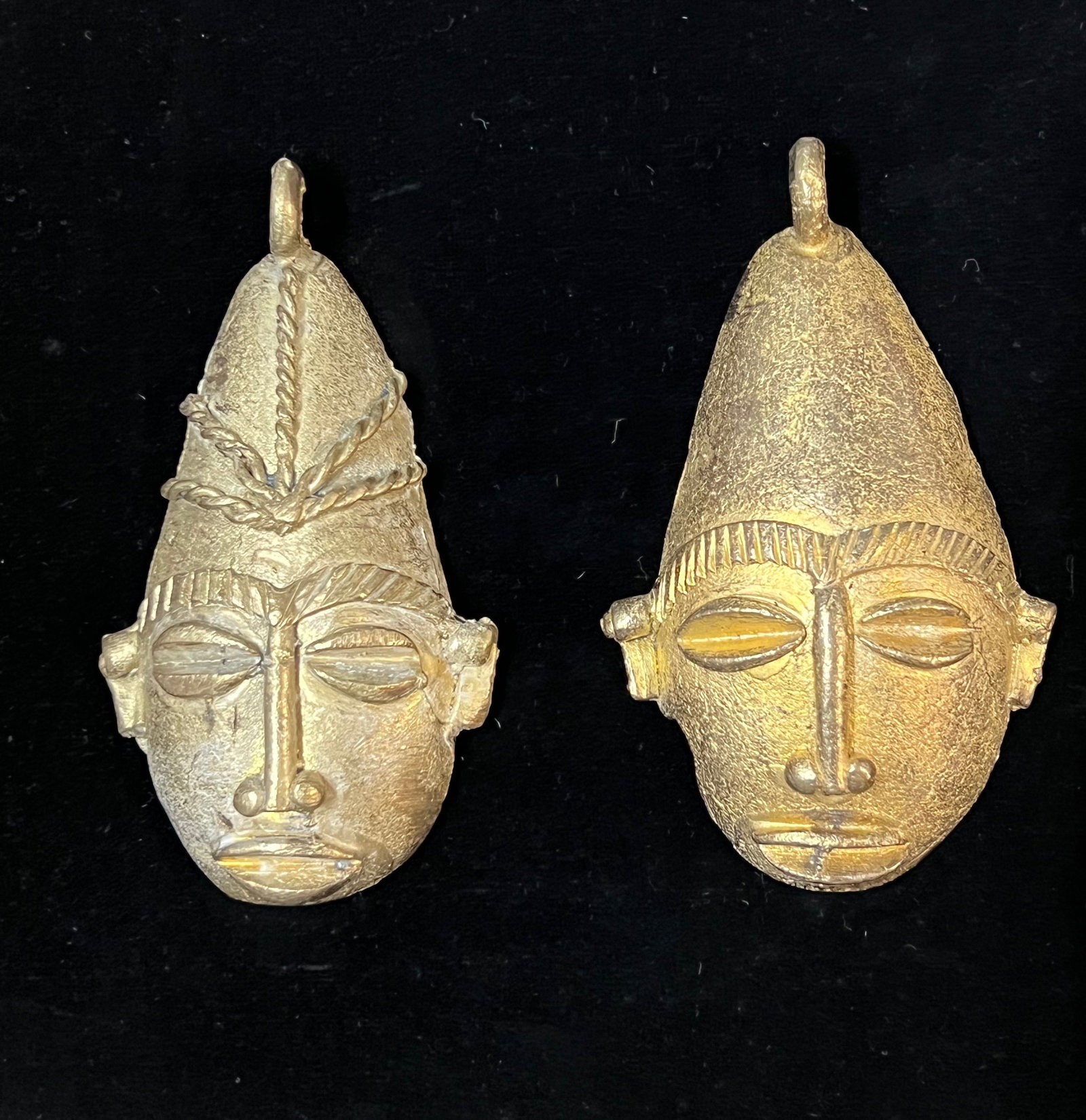 Ashanti Brass Pendant 2 Pieces: African Tribal Brass Pendant 2 Pieces. The dimension is 3 inches high x 3.75 inches wide. Please be aware that some of the items are vintage, secondhand, old ages, antiques and may have a defects or s
