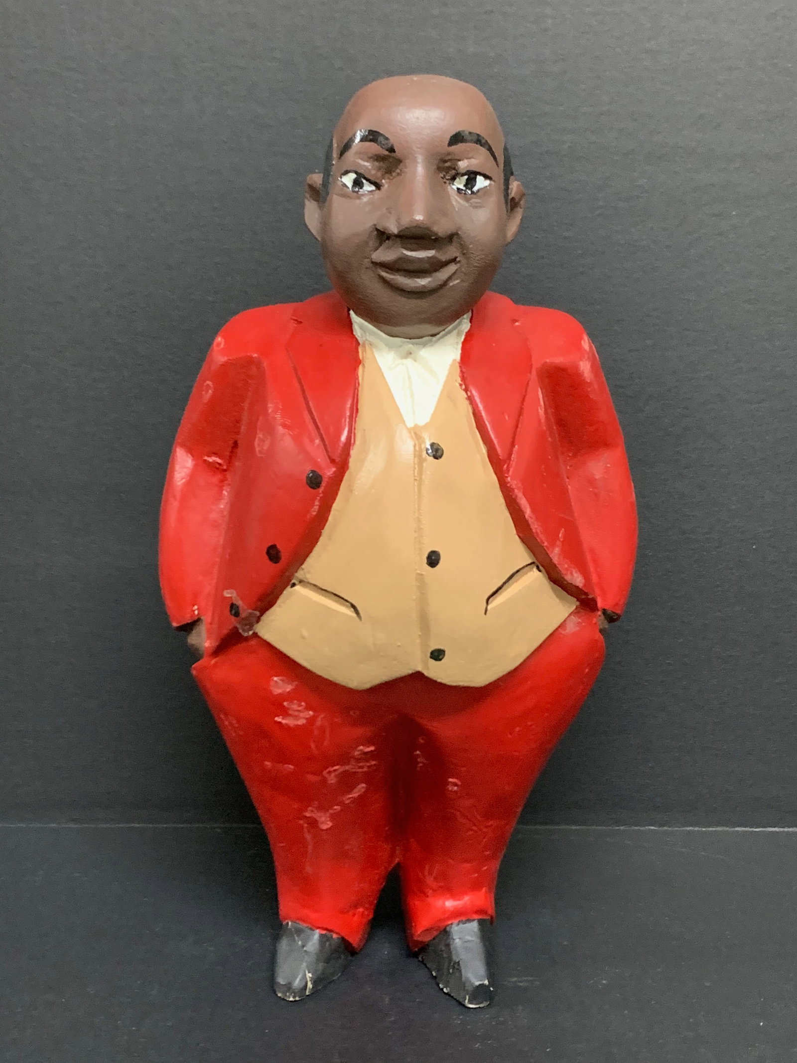 Carved Wood Male Colonial Statue: African Tribal Art Carved Wood Male Colonial Statue. The dimension is 13 inches high x 7 inches wide. Please be aware that some of the items are vintage, secondhand, old ages, antiques and may have a 