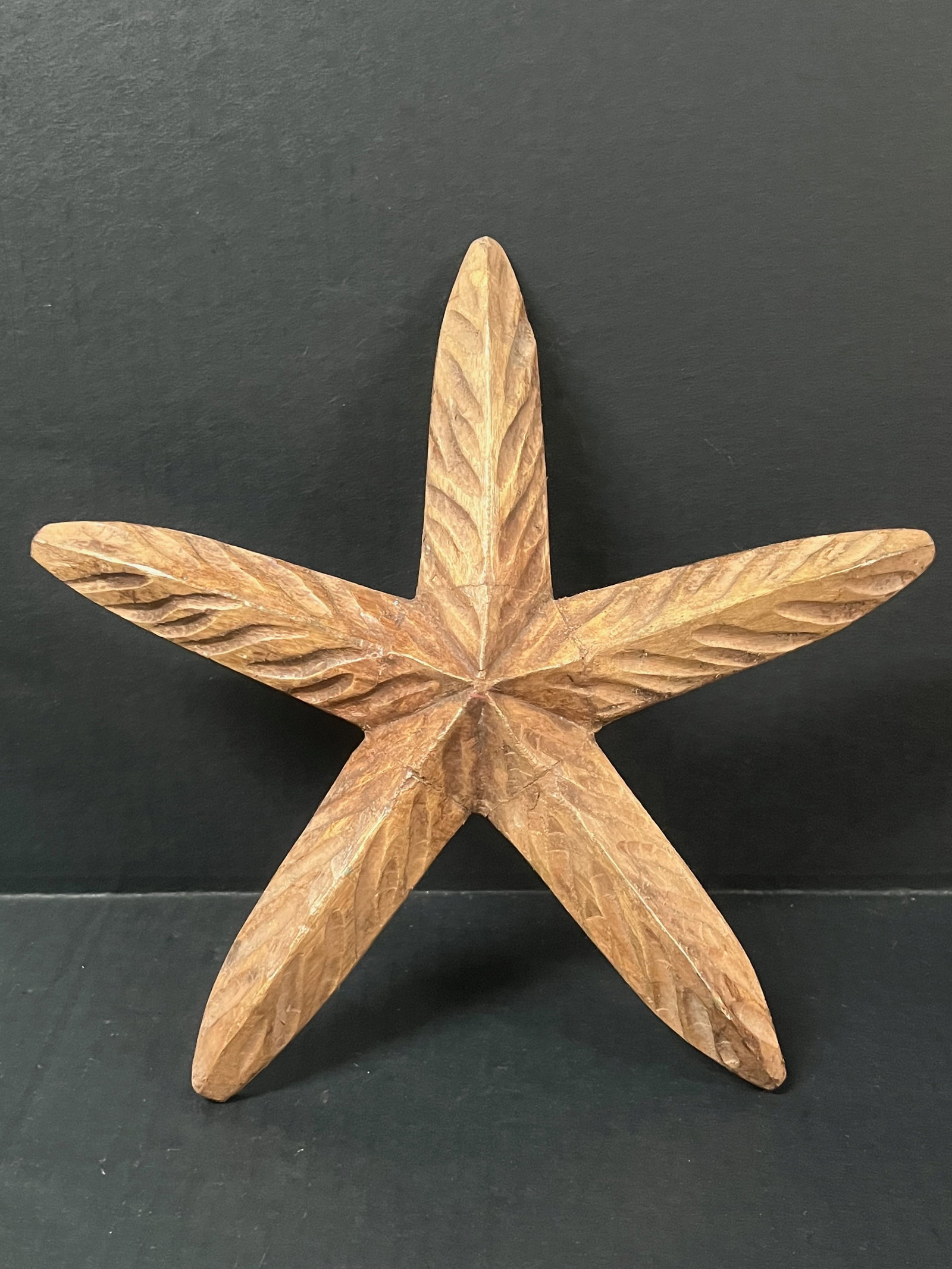 Carved Wood Starfish Sculpture: African Tribal Art Carved Wood Starfish Plaque Sculpture. The dimension is 10 inches high x 10.75 inches wide. Please be aware that some of the items are vintage, secondhand, old ages, antiques and ma