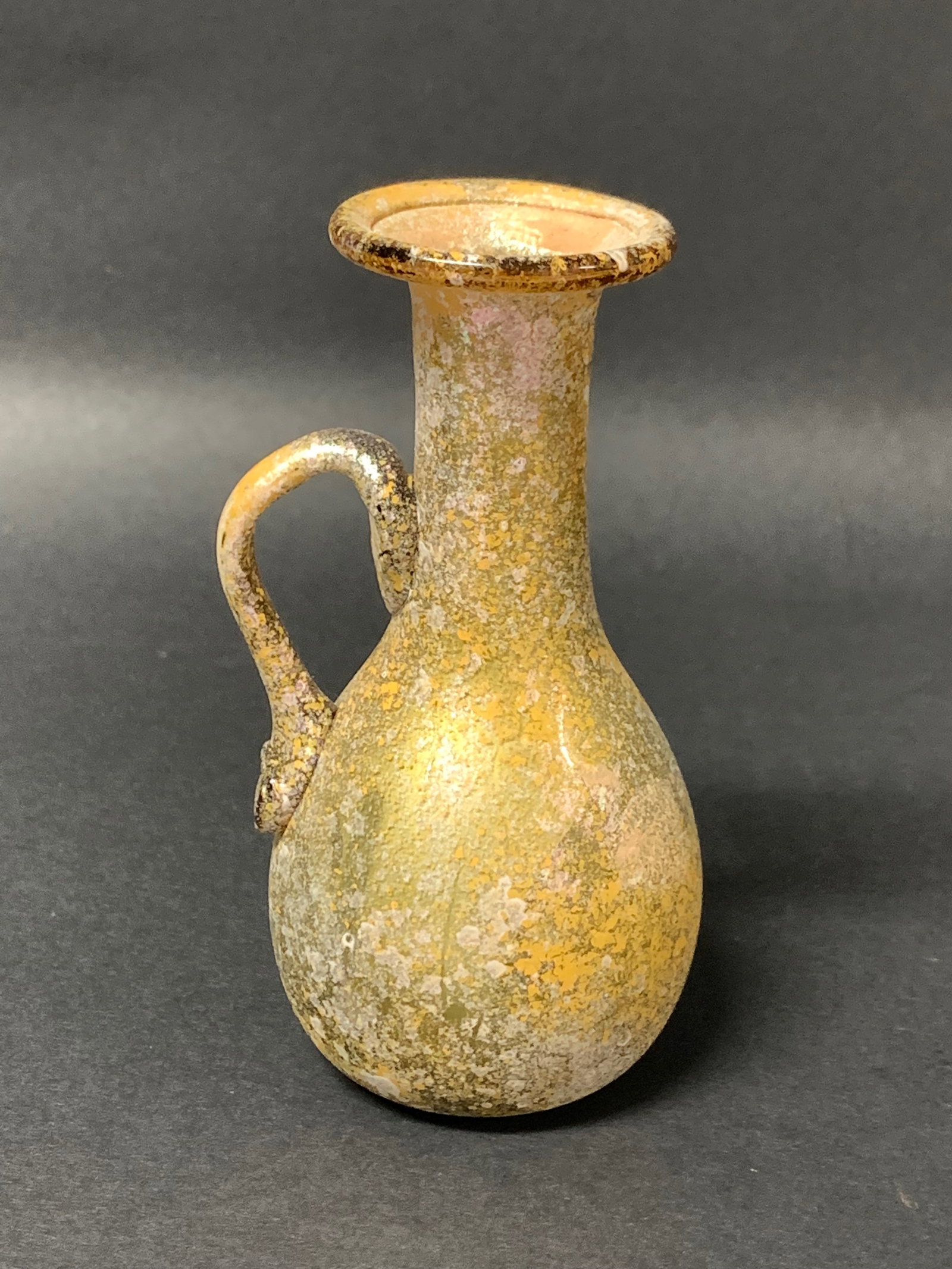 Roman Art Style Glass Bottle: Roman Ar Style Glass Bottle. The dimension is 4.5 inches high x 2.5 inches wide. Please be aware that some of the items are vintage, secondhand, old ages, antiques and may have a defects or sign of