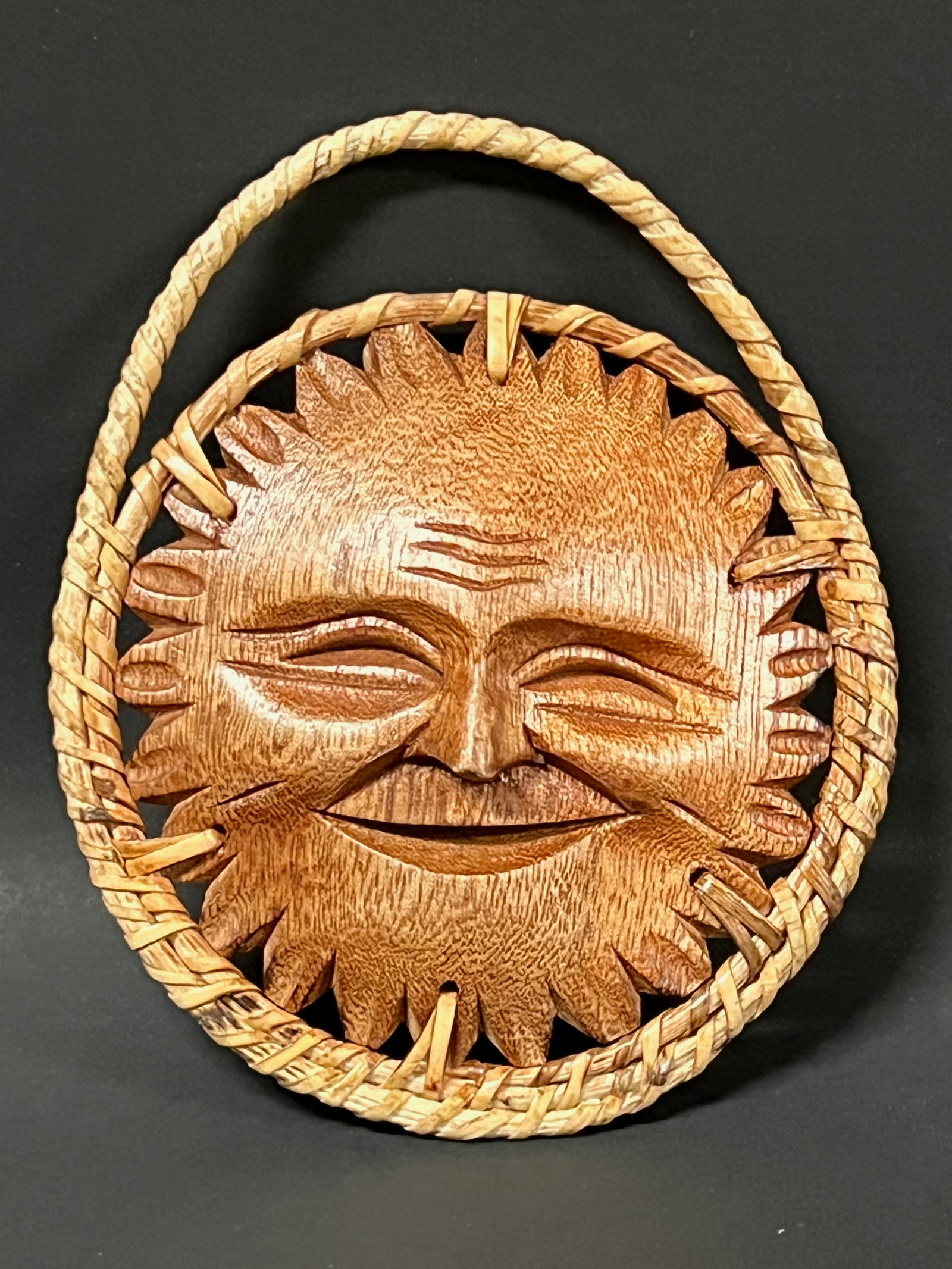 Whimsical Carved Wood Smiling Sun Face Wall Plaque Sculpture: Folk Art Whimsical Carved Wood Smiling Sun Face Wall Sculpture with Woven Rattan Border. The dimension is 5.5 inches high x 4.5 inches wide. Please be aware that some of the items are vintage,