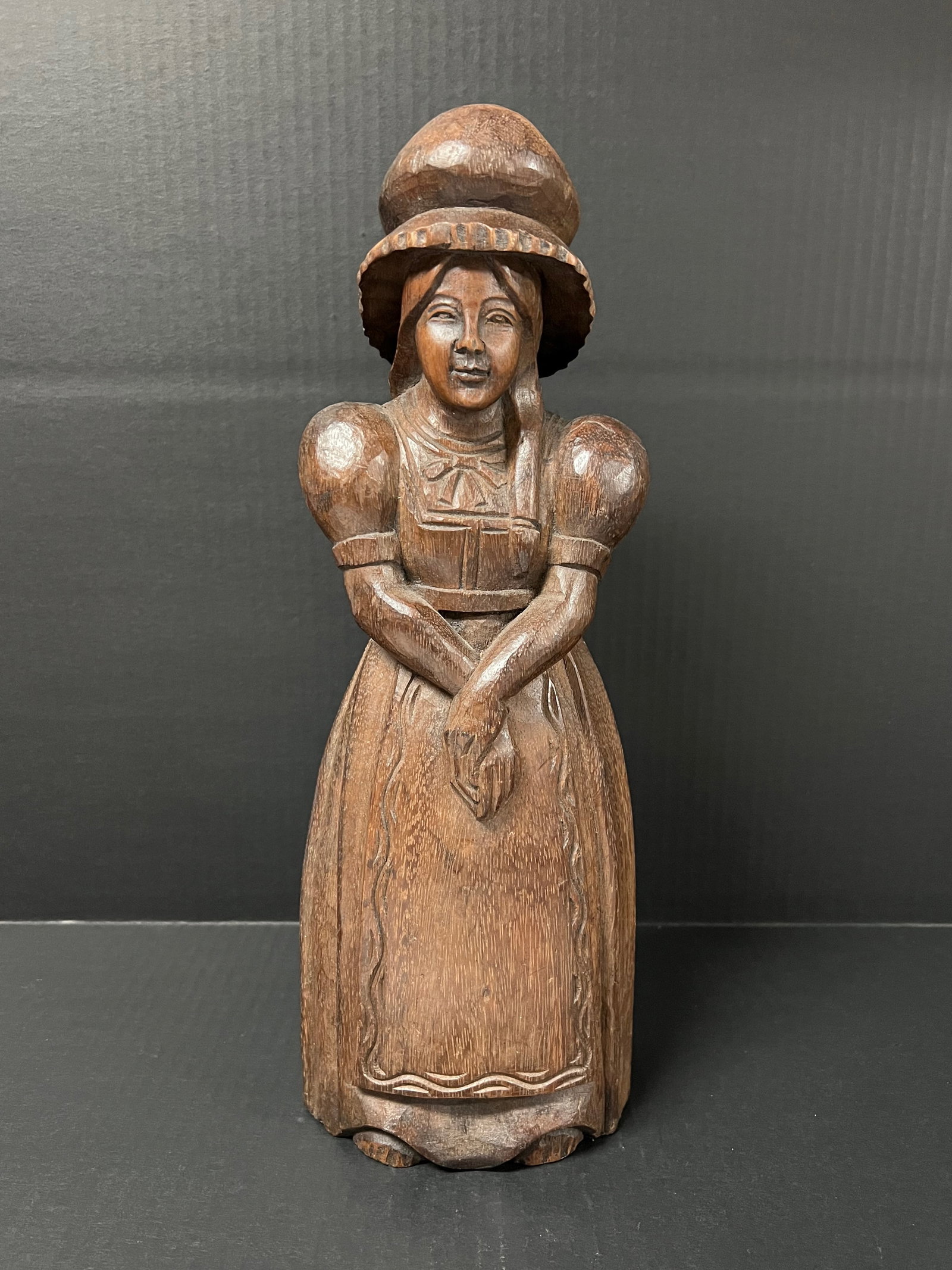 Vintage Hand Carved Wooden Woman with Hat Sculpture: Vintage Folk Art Hand Carved Wooden Woman with Hat Sculpture. The dimension is 15.5 inches high x 4.75 inches wide. Please be aware that some of the items are vintage, secondhand, old ages, antiques a