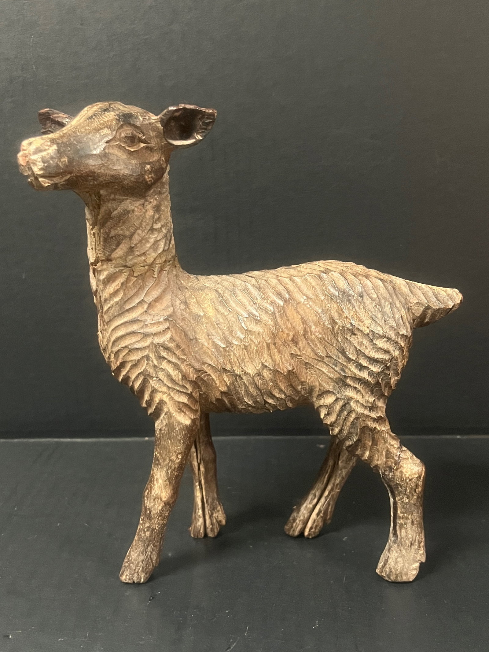 Vintage Hand Carved Wooden Deer Sculpture: Vintage Folk Art Hand Carved Wooden Deer Sculpture. The dimension is 9.5 inches high x 8 inches wide. Please be aware that some of the items are vintage, secondhand, old ages, antiques and may have a 