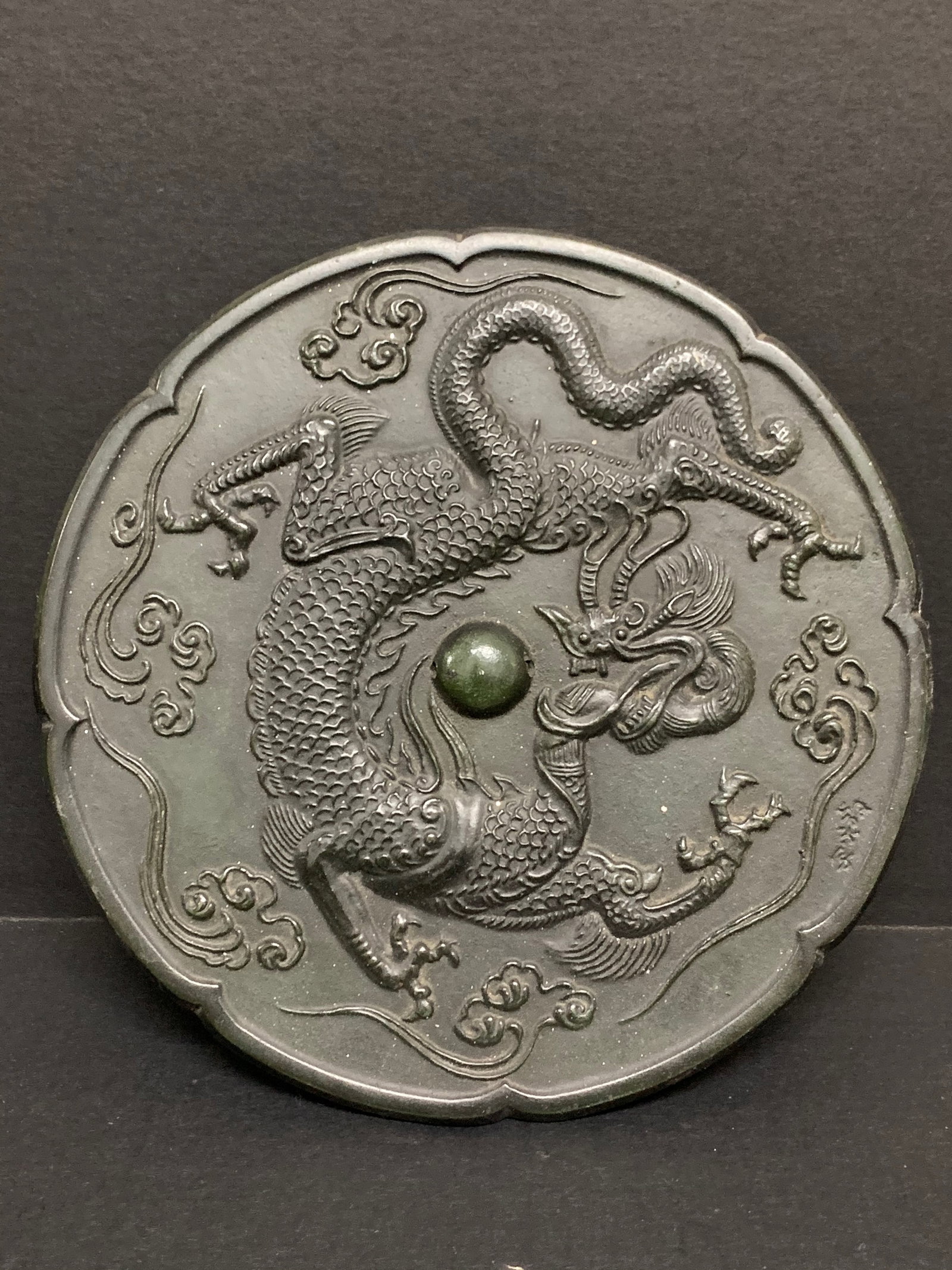 Bronze Mirror with Dragon Design: Chinese Art Bronze Mirror with Dragon Design. The dimension is 8 inches high x 8 inches . Please be aware that some of the items are vintage, secondhand, old ages, antiques and may have a defects or s