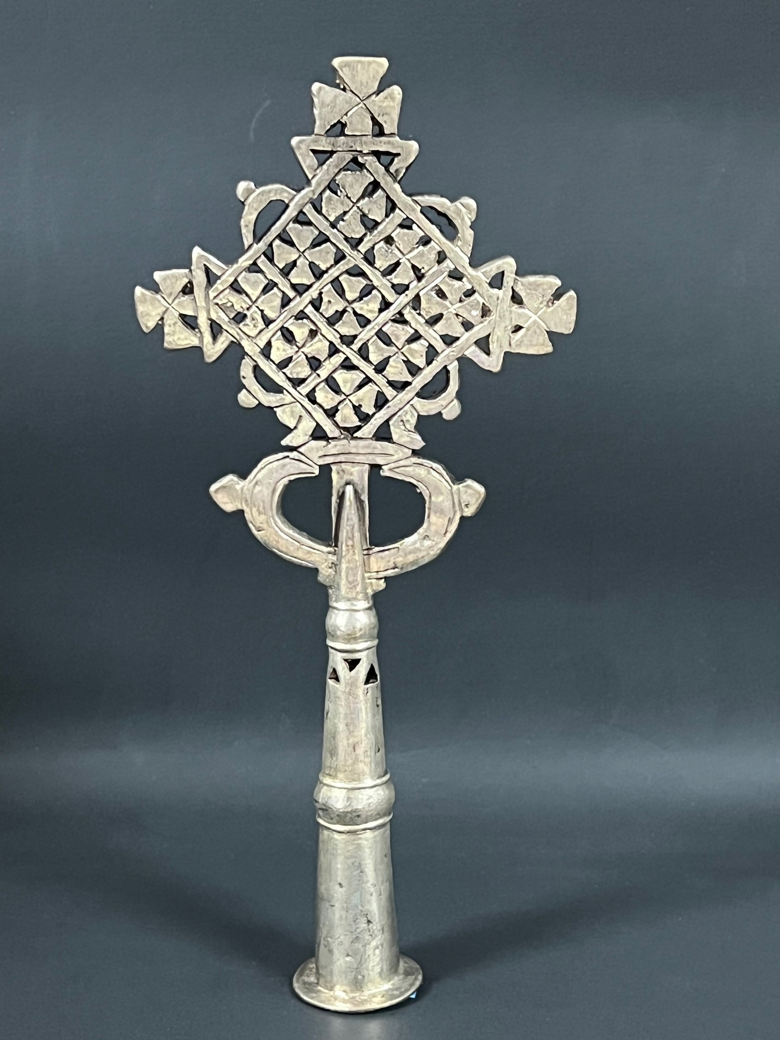 Ethiopian Processional Metal Cross: African Tribal Art Ethiopian Processional Metal Cross. The dimension is 9 inches high x 4 inches wide. Please be aware that some of the items are vintage, secondhand, old ages, antiques and may have