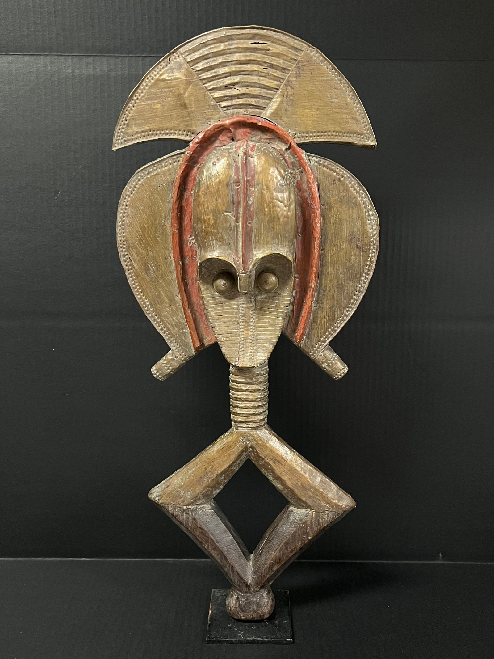 Bakota Reliquary Guardian Double Face Statue with Stand: African Tribal Art Carved Wood Bakota Reliquary Guardian Double Face Statue with Stand. The dimension is 23 inches high x 11.5 inches . Please be aware that some of the items are vintage, secondhand, 