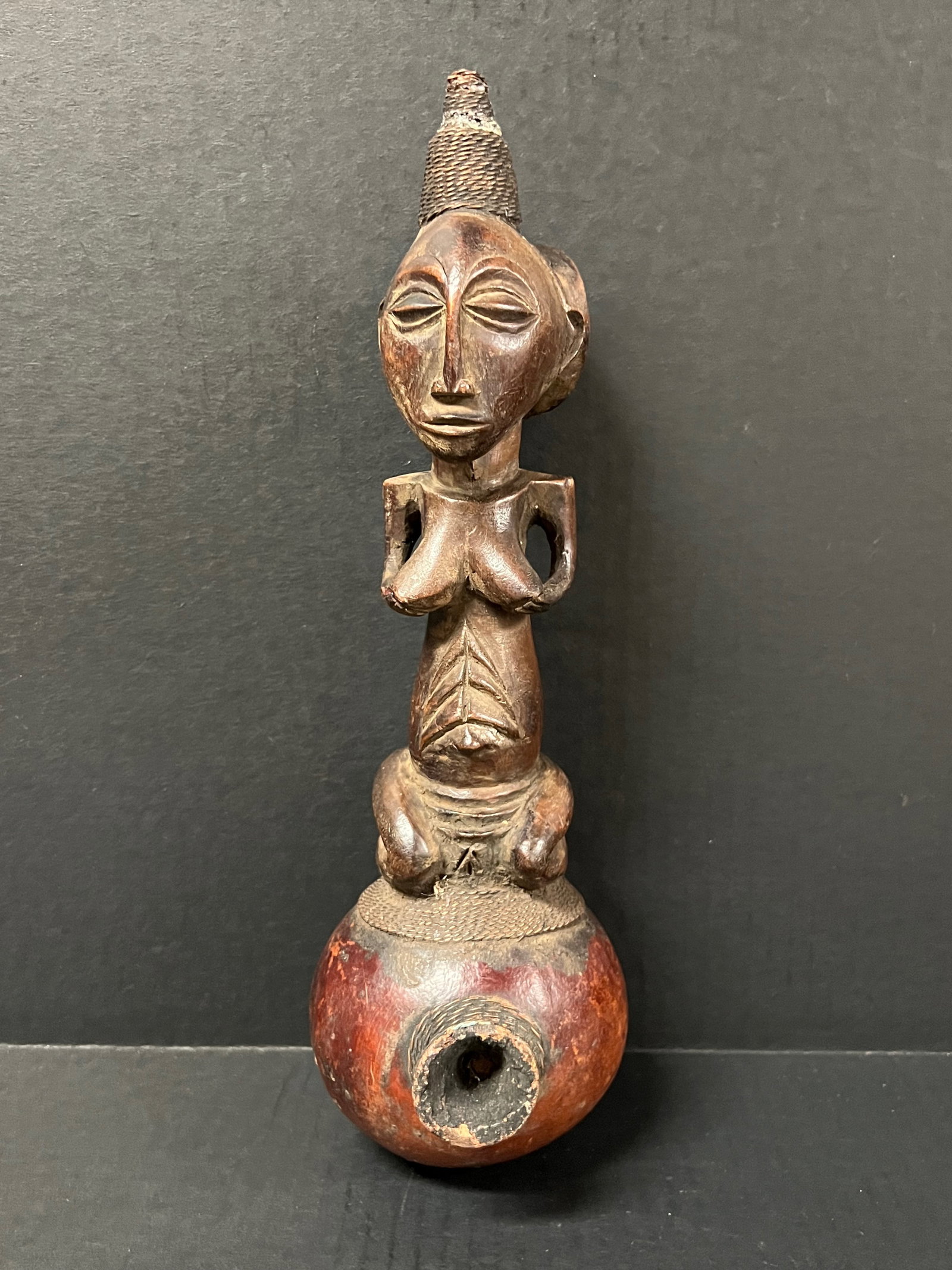 African Luba Pipe with Female Figure: African Tribal Art Carved Wood Luba Pipe with Female Figure. The dimension is 11 inches high x 2 inches . Please be aware that some of the items are vintage, secondhand, old ages, antiques and may
