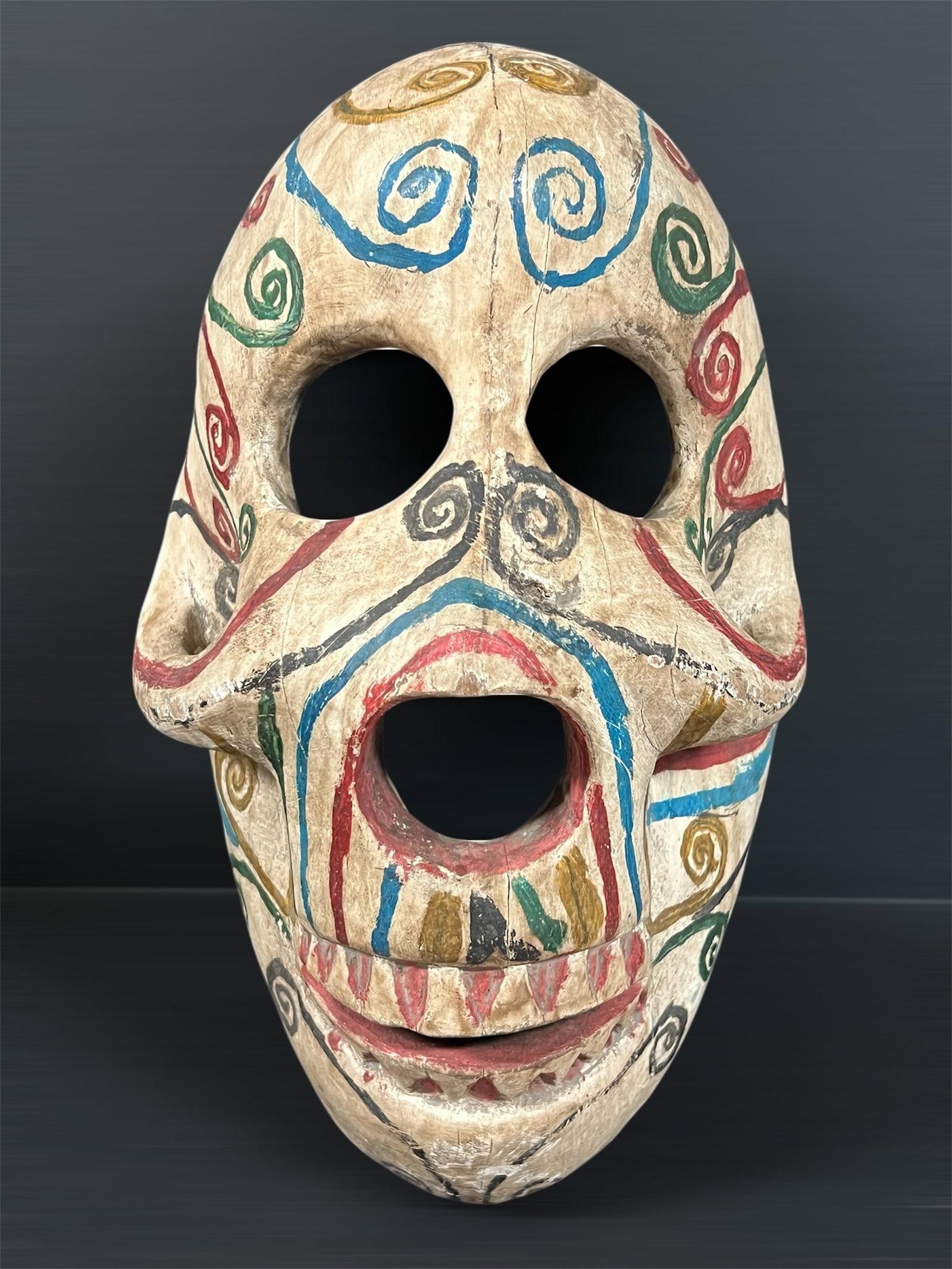 Carved Wood Skull Mask: African Tribal Art Carved Wood Skull Mask. The dimension is 13 inches high x 8.5 inches wide. Please be aware that some of the items are vintage, secondhand, old ages, antiques and may have a defects