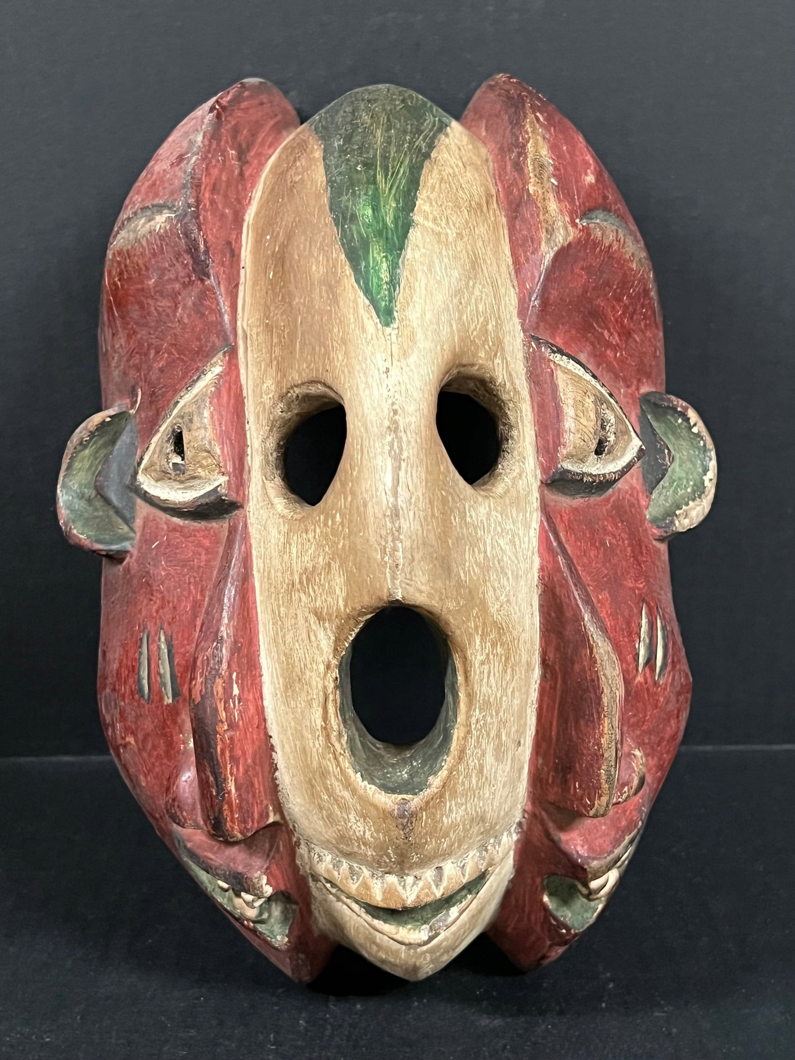 Carved Wood Skull Mask: African Tribal Art Carved Wood Skull Mask. The dimension is 11 inches high x 8.5 inches wide. Please be aware that some of the items are vintage, secondhand, old ages, antiques and may have a defects 