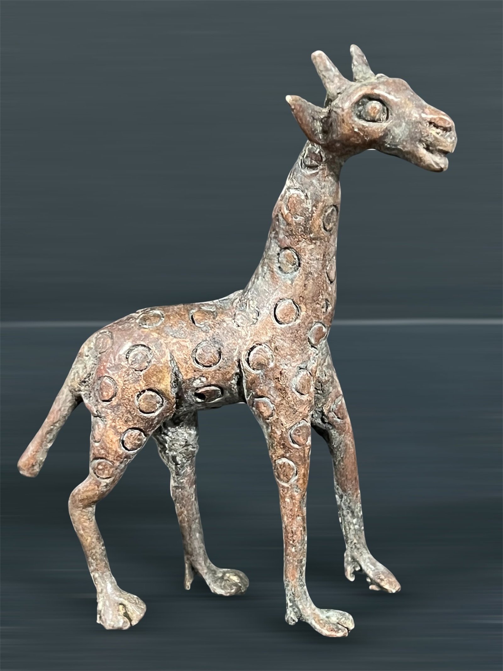 Bronze Giraffe Sculpture: African Tribal Art Bronze Giraffe Sculpture. The dimension is 5 inches high x 3.5 inches wide. Please be aware that some of the items are vintage, secondhand, old ages, antiques and may have a defects