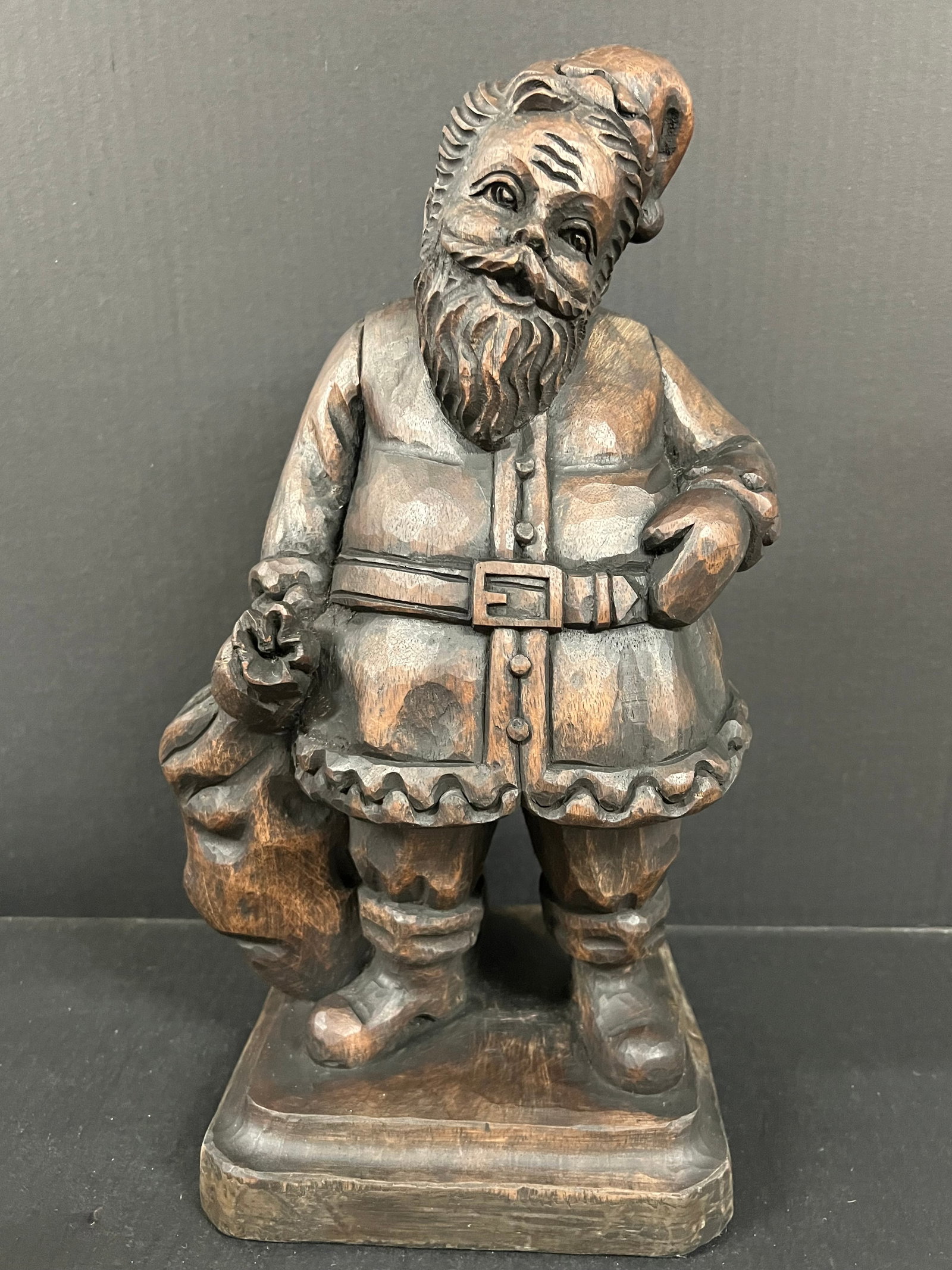 Carved Wood Santa Claus Sculpture: African Tribal Art Carved Wood Santa Claus Sculpture The dimension is 16 inches high x 7.5 inches wide. Please be aware that some of the items are vintage, secondhand, old ages, antiques and may have 