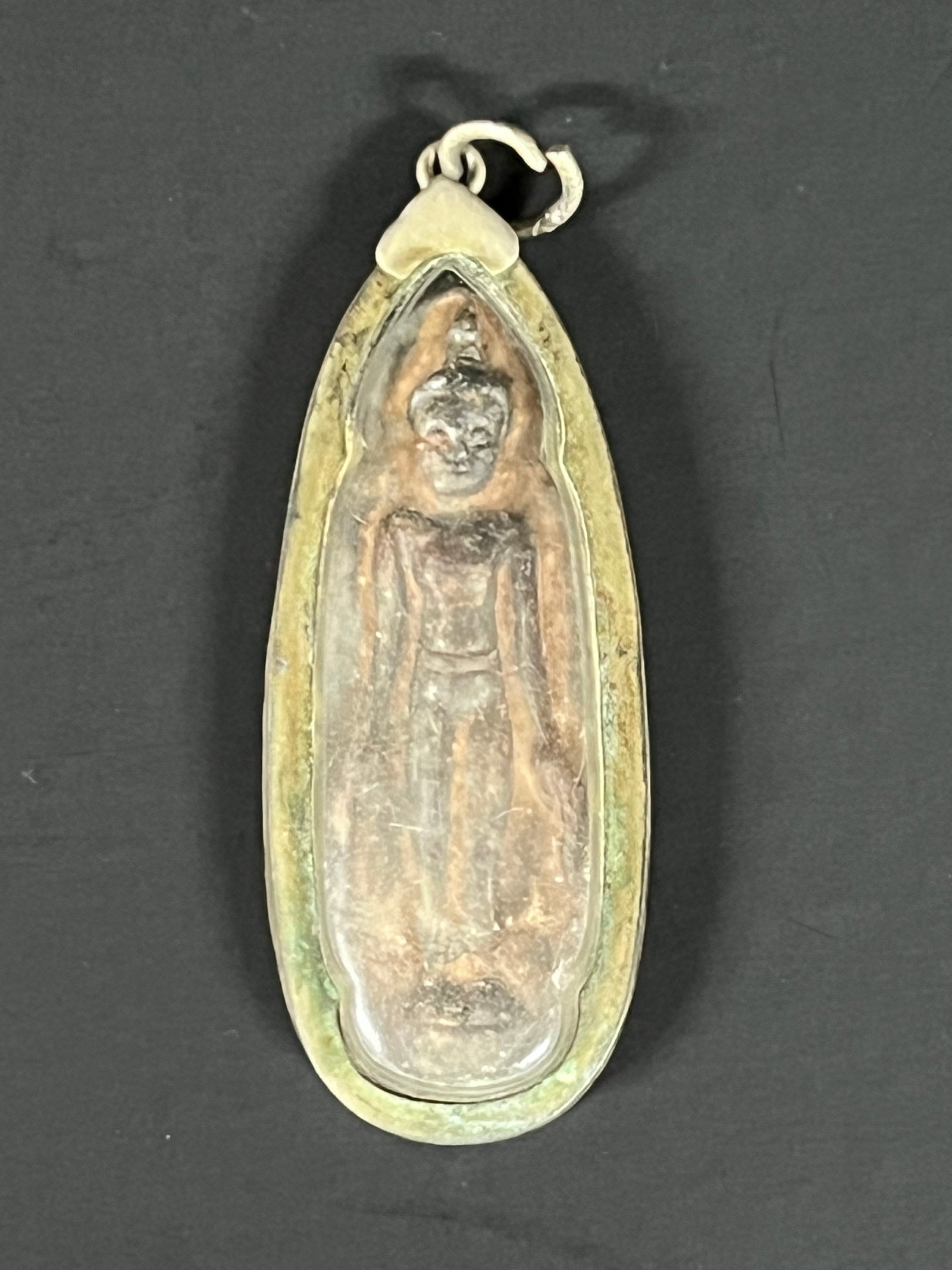 Thai Clay Buddha Amulet Charm Pendant: Thai Clay Buddha Amulet Charm Pendant. The dimension is 2 inches high x 1 inches wide. Please be aware that some of the items are vintage, secondhand, old ages, antiques and may have a defects or