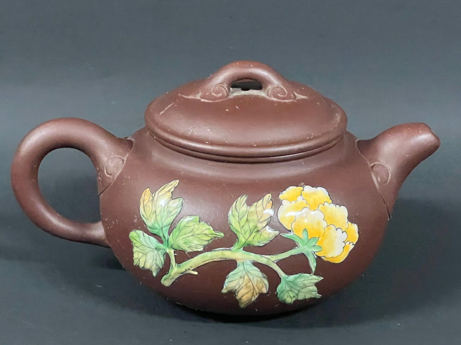 Chinese Art Yixing Clay and Enamel Tea Pot: Chinese Art Yixing Clay and Enamel Tea Pot. The dimension is 3 inches high x 7 inches wide. Please be aware that some of the items are vintage, secondhand, old ages, antiques and may have a defects or