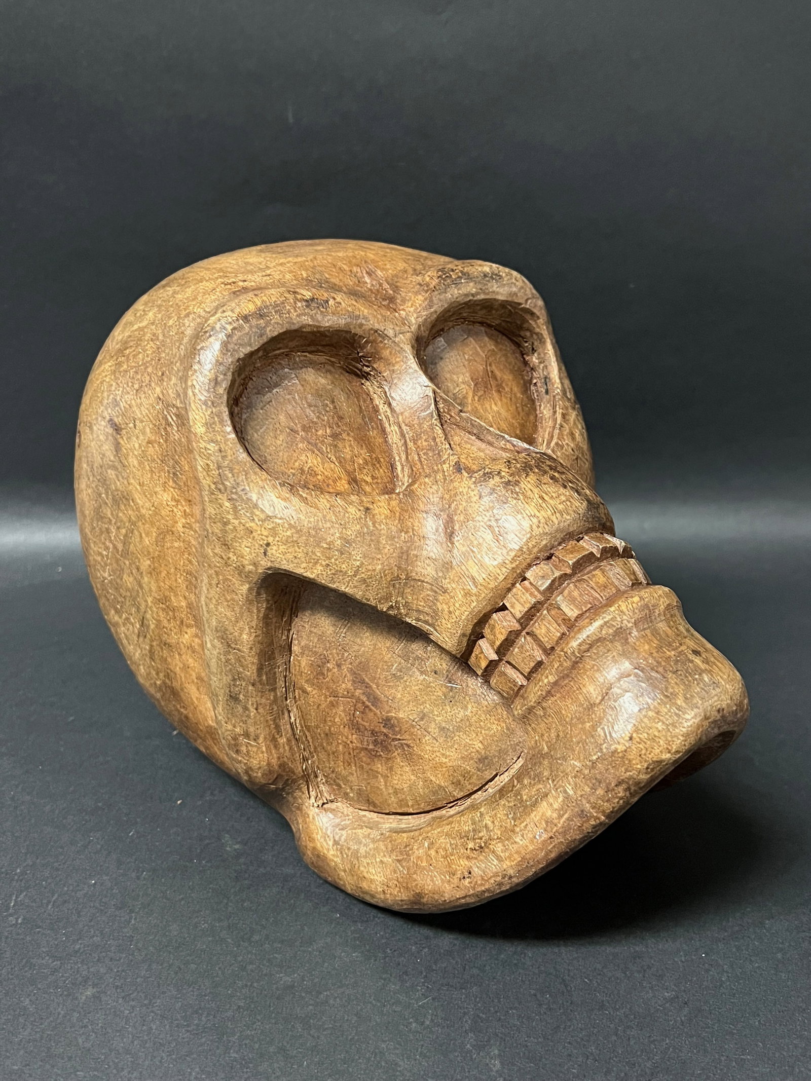 Vintage Carved Wood Skull Sculpture: Vintage Carved Wood Skull Sculpture. The dimension is 6.75 inches high x 9 inches wide. Please be aware that some of the items are vintage, secondhand, old ages, antiques and may have a defects or sig