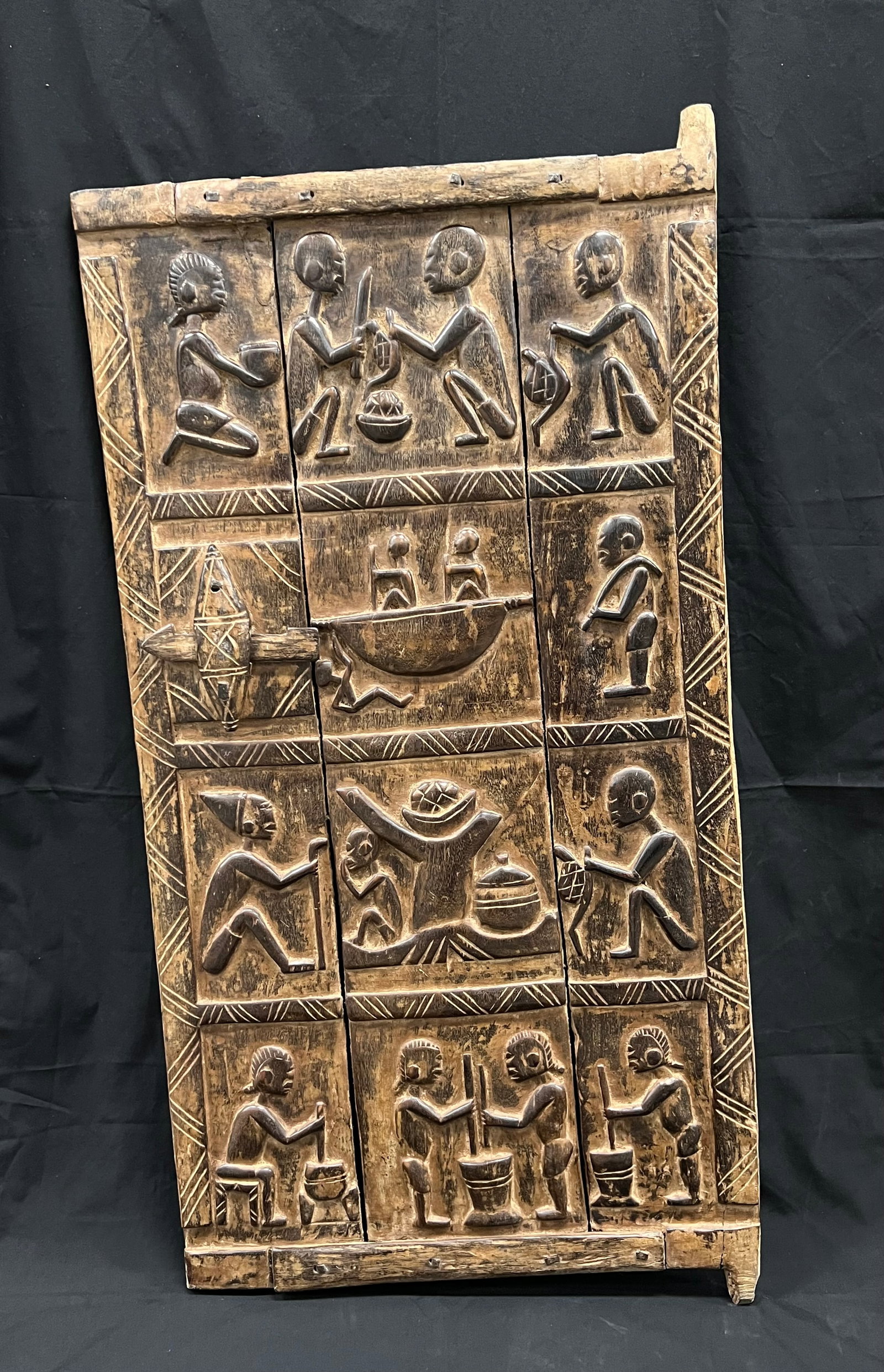 African Tribal Art Large Dogon Door: African Tribal Art Large Dogon Door. The Opening dimension is 48 inches high x 23.5 inches wide. Please be aware that some of the items are vintage, secondhand, old ages, antiques and may have a defec