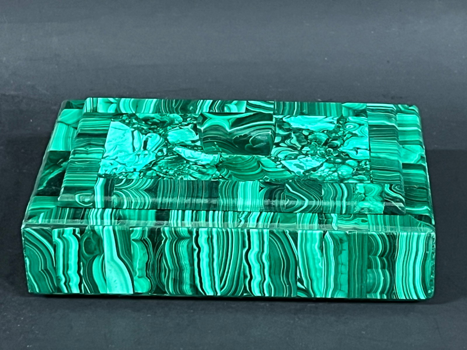 Carved Malachite Stone Jewelry Box: Carverd Malachite Stone Jewelry Box. The dimension is 2.25 inches high x 6 inches wide. Please be aware that some of the items are vintage, secondhand, old ages, antiques and may have a defects or