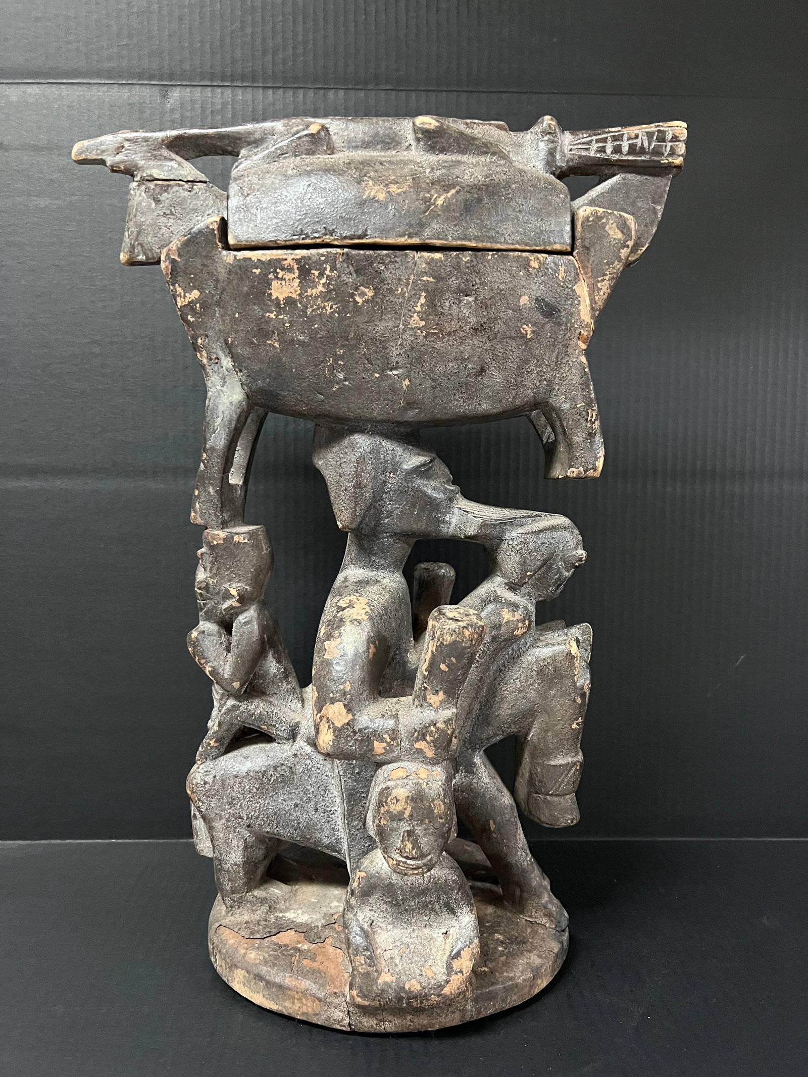 African Art Carved Wood Yuroba Container Sculpture: African Tribal Art Carved Wood Yuroba Container Sculpture. The dimension is 21 inches high x 14.5 inches wide. Please be aware that some of the items are vintage, secondhand, old ages, antiques and