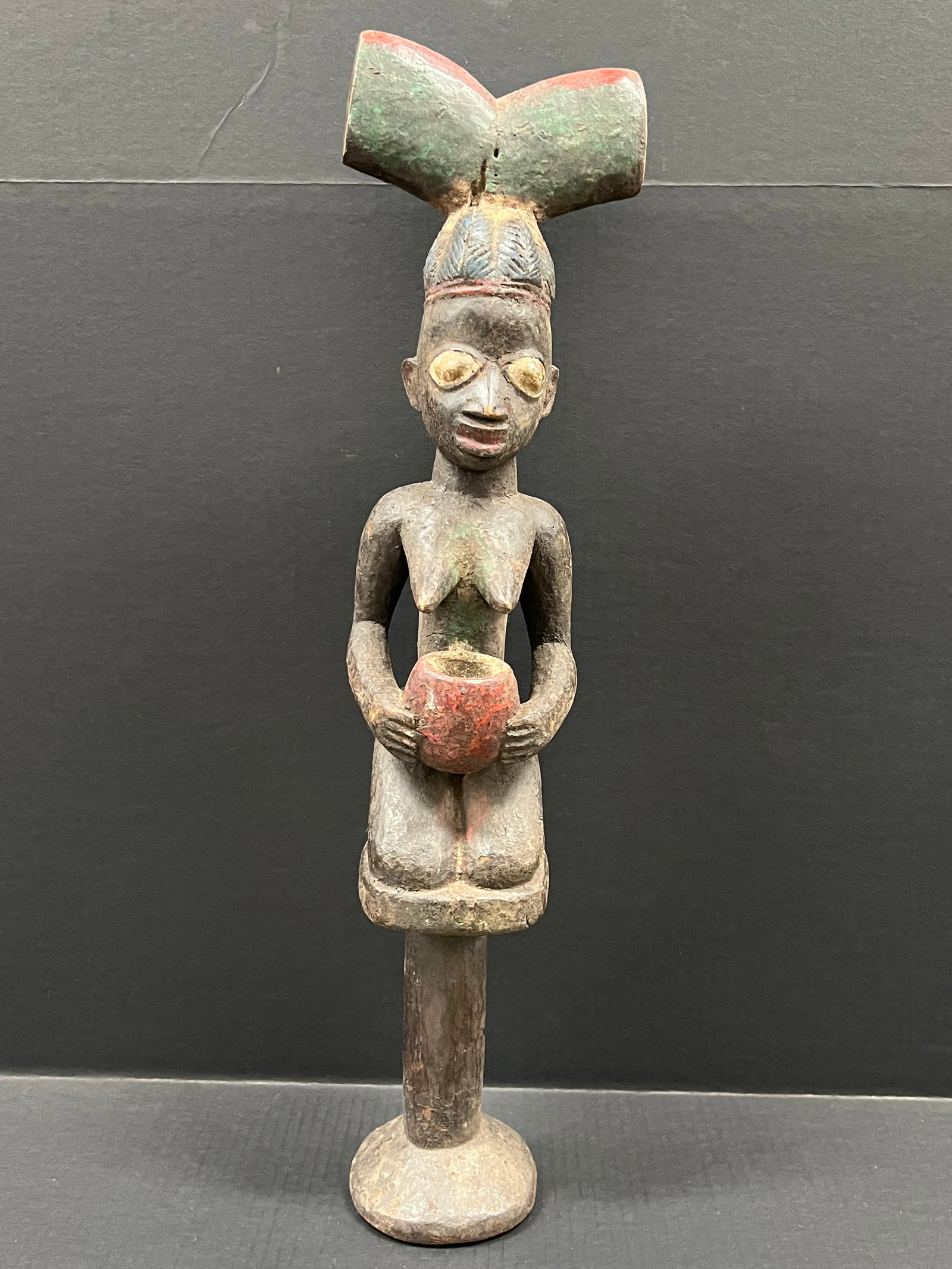 Yoruba Shango Statue: African Tribal Art Carved Wood Yoruba Shango Statue. The dimension is 26.75 inches high x 6.5 inches wide. Please be aware that some of the items are vintage, secondhand, old ages, antiques and may ha