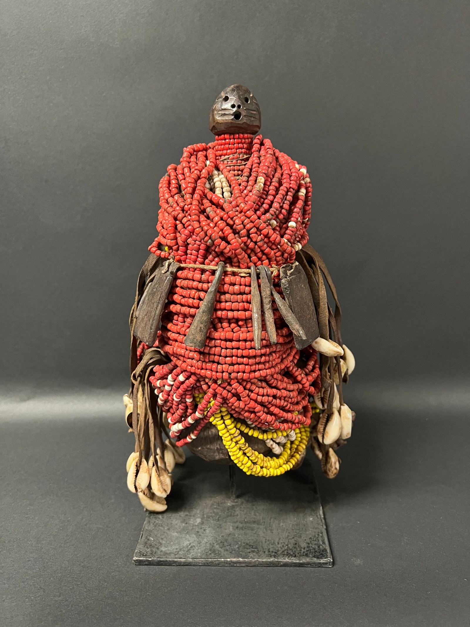 Carved Wood Beaded Fali Fertility Doll: African Tribal Art Carved Wood Beaded Fali Fertility Doll. The dimension is 11.75 inches high x 7 inches wide. Please be aware that some of the items are vintage, secondhand, old ages, antiques and
