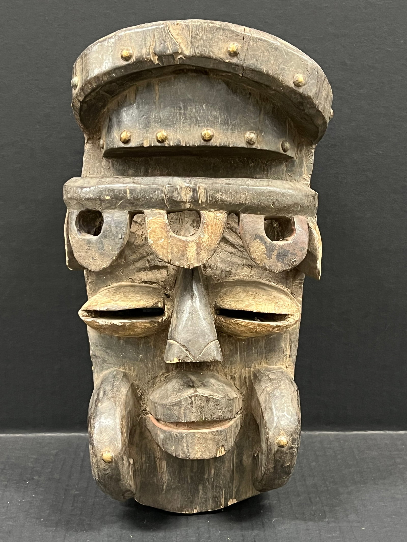 Carved Wood Bete Mask: African Tribal Art Carved Wood Bete Mask. The dimension is 14.5 inches high x 7.5 inches wide. Please be aware that some of the items are vintage, secondhand, old ages, antiques and may have a
