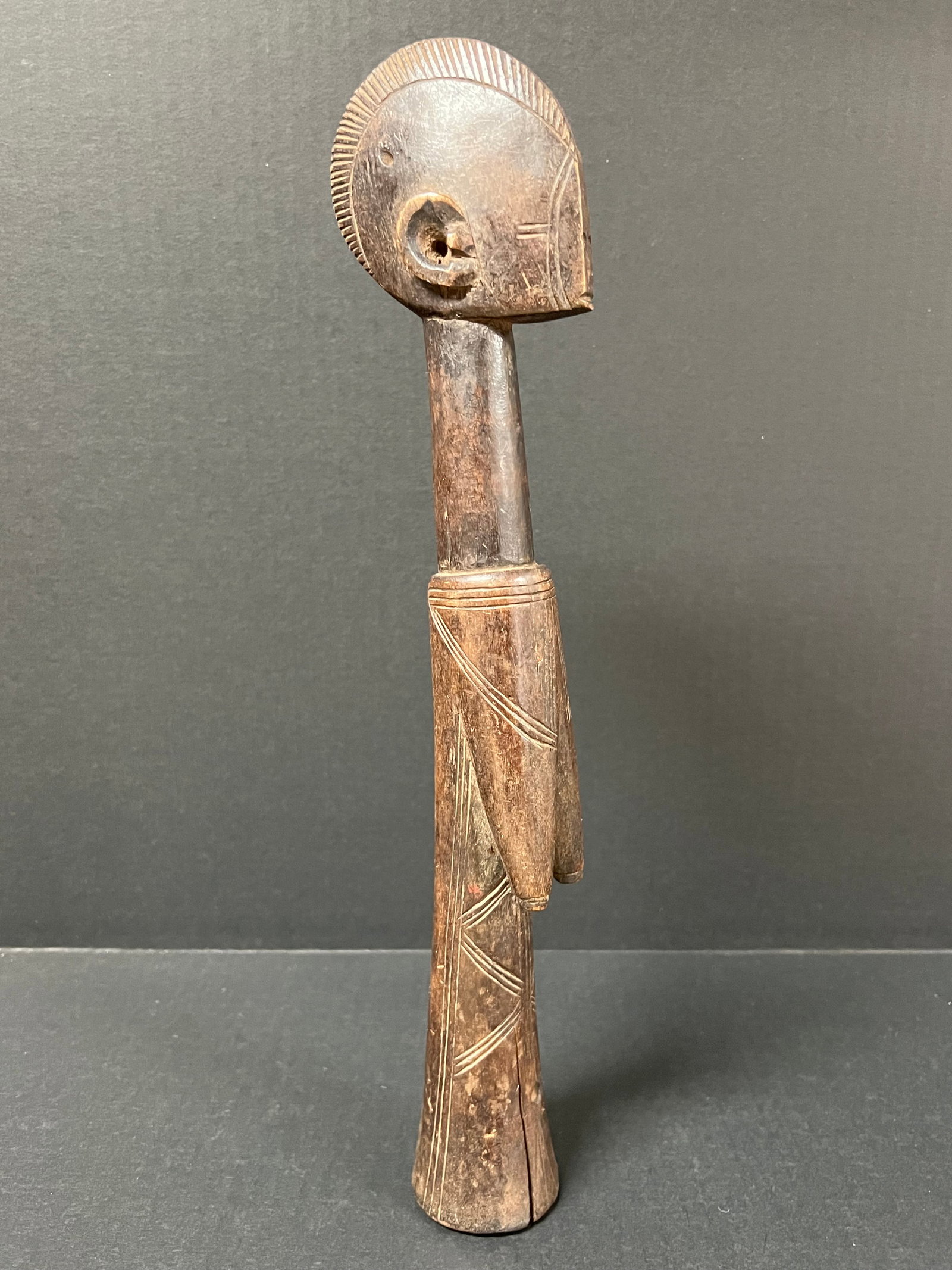 Carved Wood Mossi Fertility Doll: African Tribal Art Carved Wood Mossi Fertility Doll. The dimension is 14.5 inches high x 3.25 inches wide. Please be aware that some of the items are vintage, secondhand, old ages, antiques and may ha