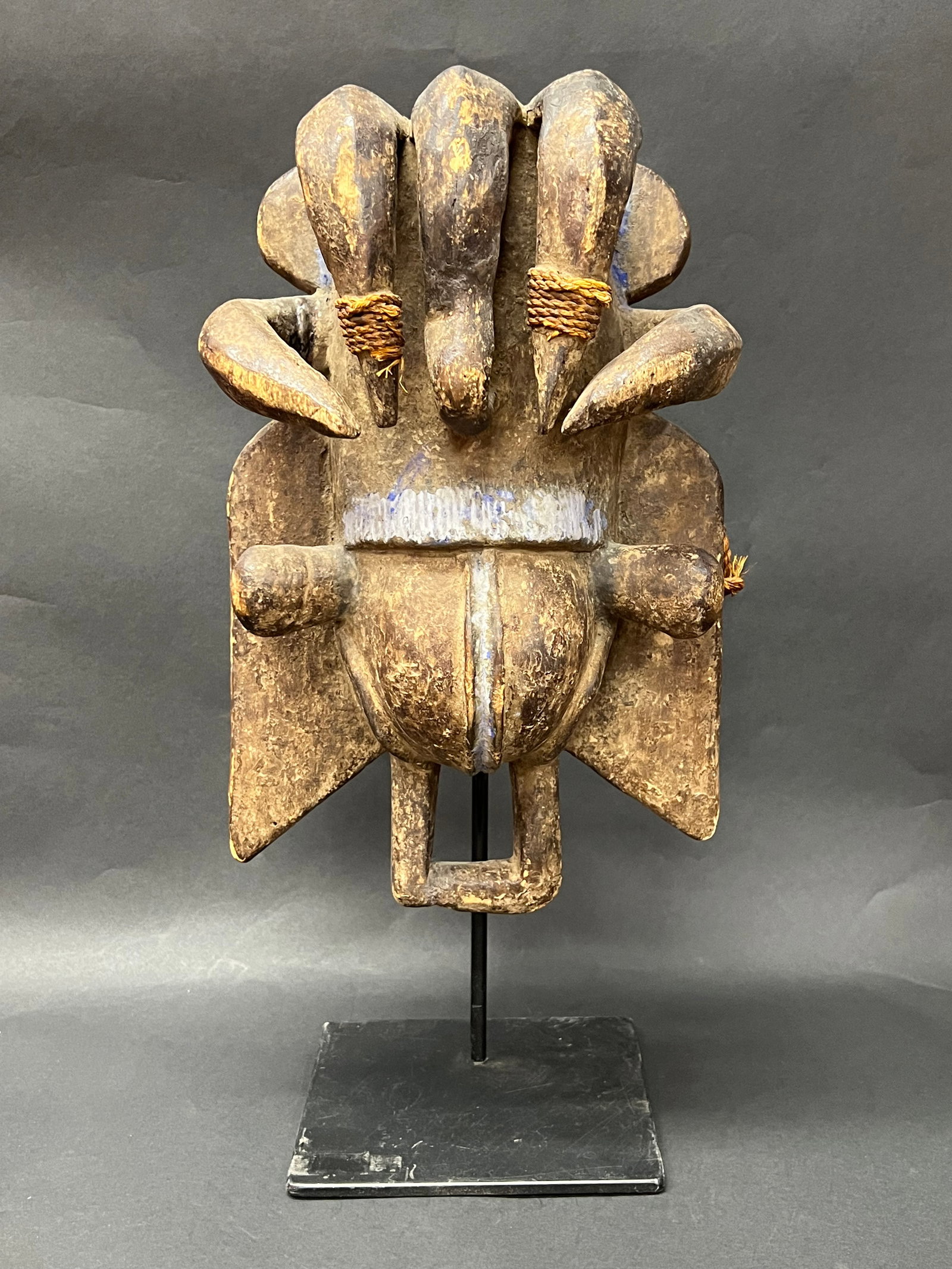 Carved Wood We Guere Mask with Stand: African Tribal Art Carved Wood We Guere Mask with Stand. The dimension is 18 inches high x 9 inches wide. Please be aware that some of the items are vintage, secondhand, old ages, antiques and may hav