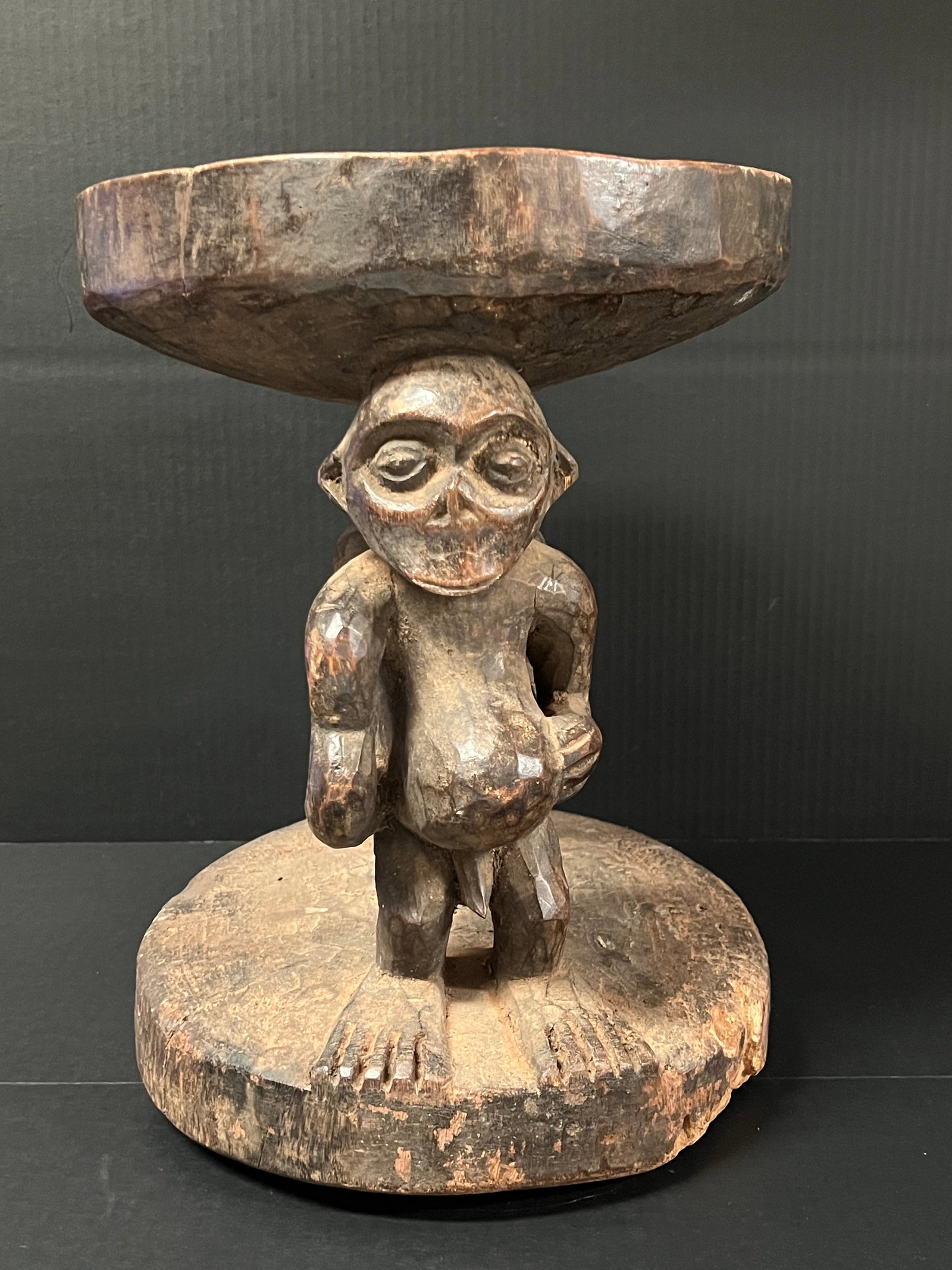 Carved Wood Bamileke Stool: African Tribal Art Carved Wood Bamileke Stool. The dimension is 15 inches high x 12.5 inches wide. Please be aware that some of the items are vintage, secondhand, old ages, antiques and may have a def