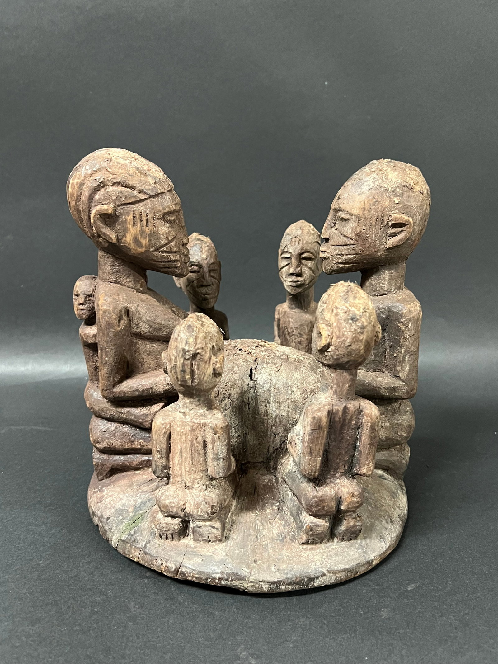 Carved Wood Dogon Statue: African Tribal Art Carved Wood Dogon Statue. The dimension is 8 inches high x 8 inches wide. Please be aware that some of the items are vintage, secondhand, old ages, antiques and may have a defects o