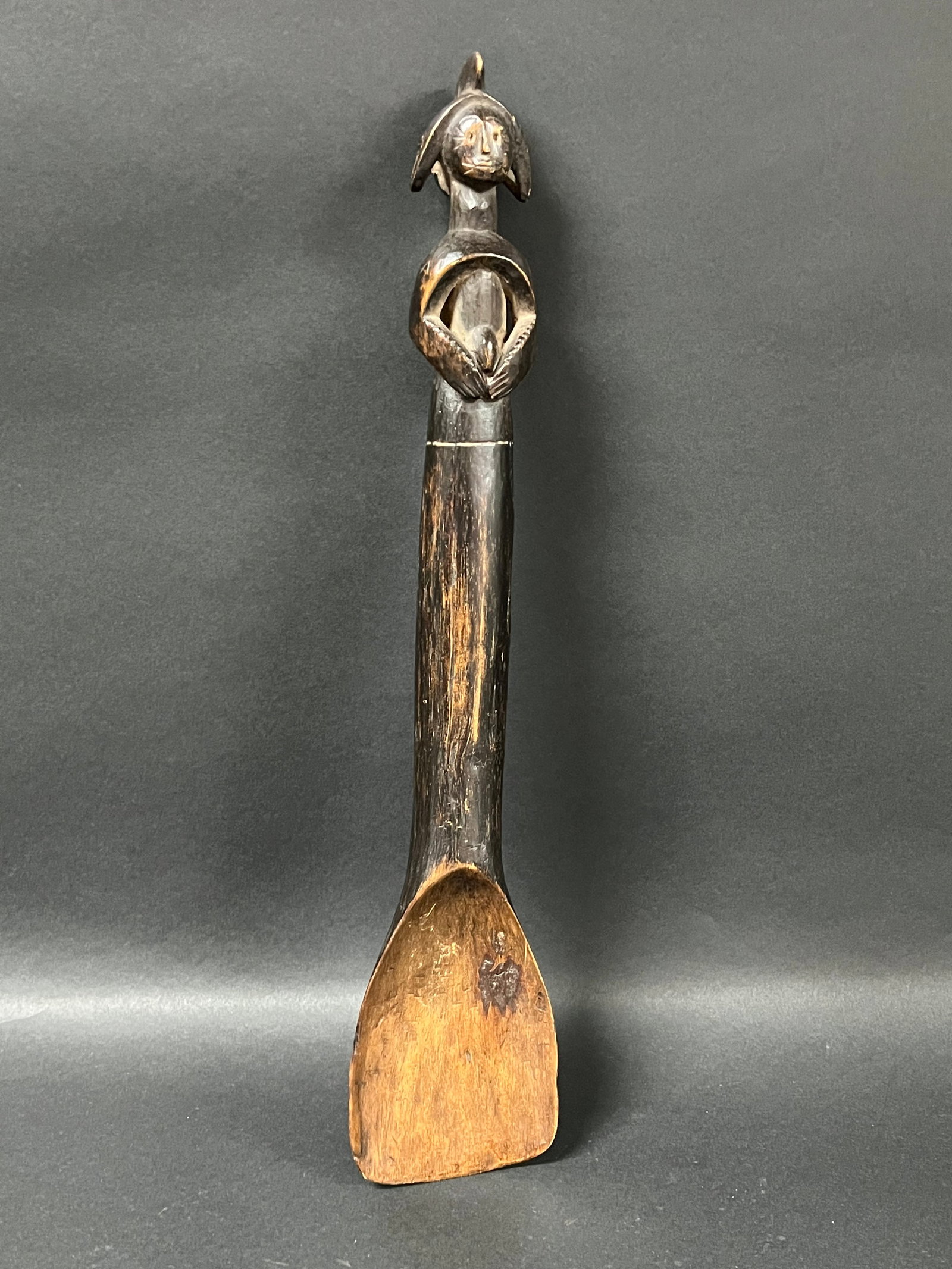 Mumuye Wooden Spoon: African Tribal Art Carved Wood Mumuye Spoon. The dimension is 17 inches high x 3.5 inches wide. Please be aware that some of the items are vintage, secondhand, old ages, antiques and may have a