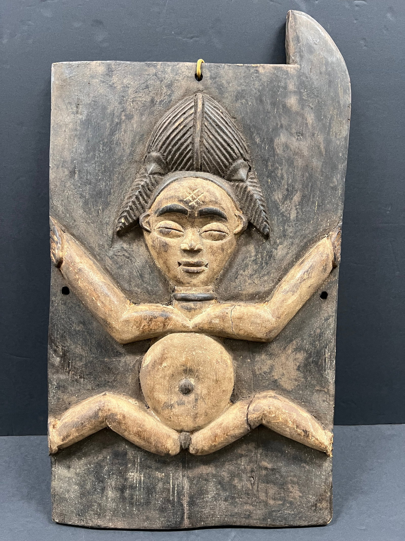 Carved Wood Punu Door: African Tribal Art Carved Wood Punu Door. The dimension is 14 inches high x 13.5 inches wide. Please be aware that some of the items are vintage, secondhand, old ages, antiques and may have a defects 