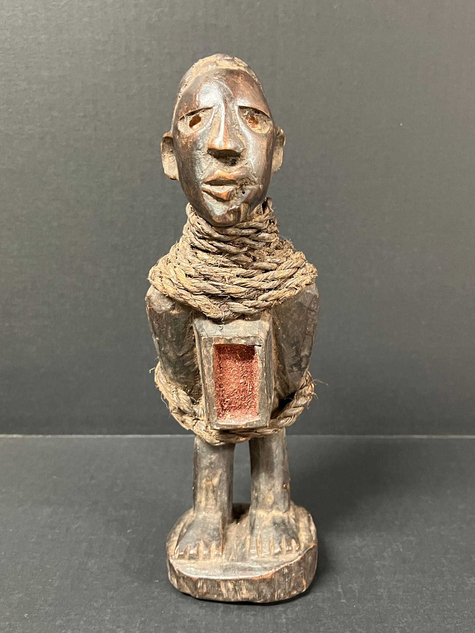 Carved Wood Bacongo Fetish Statue: African Tribal Art Carved Wood Bacongo Fetish Statue. The dimension is 11.25 inches high x 3 inches wide. Please be aware that some of the items are vintage, secondhand, old ages, antiques and may hav