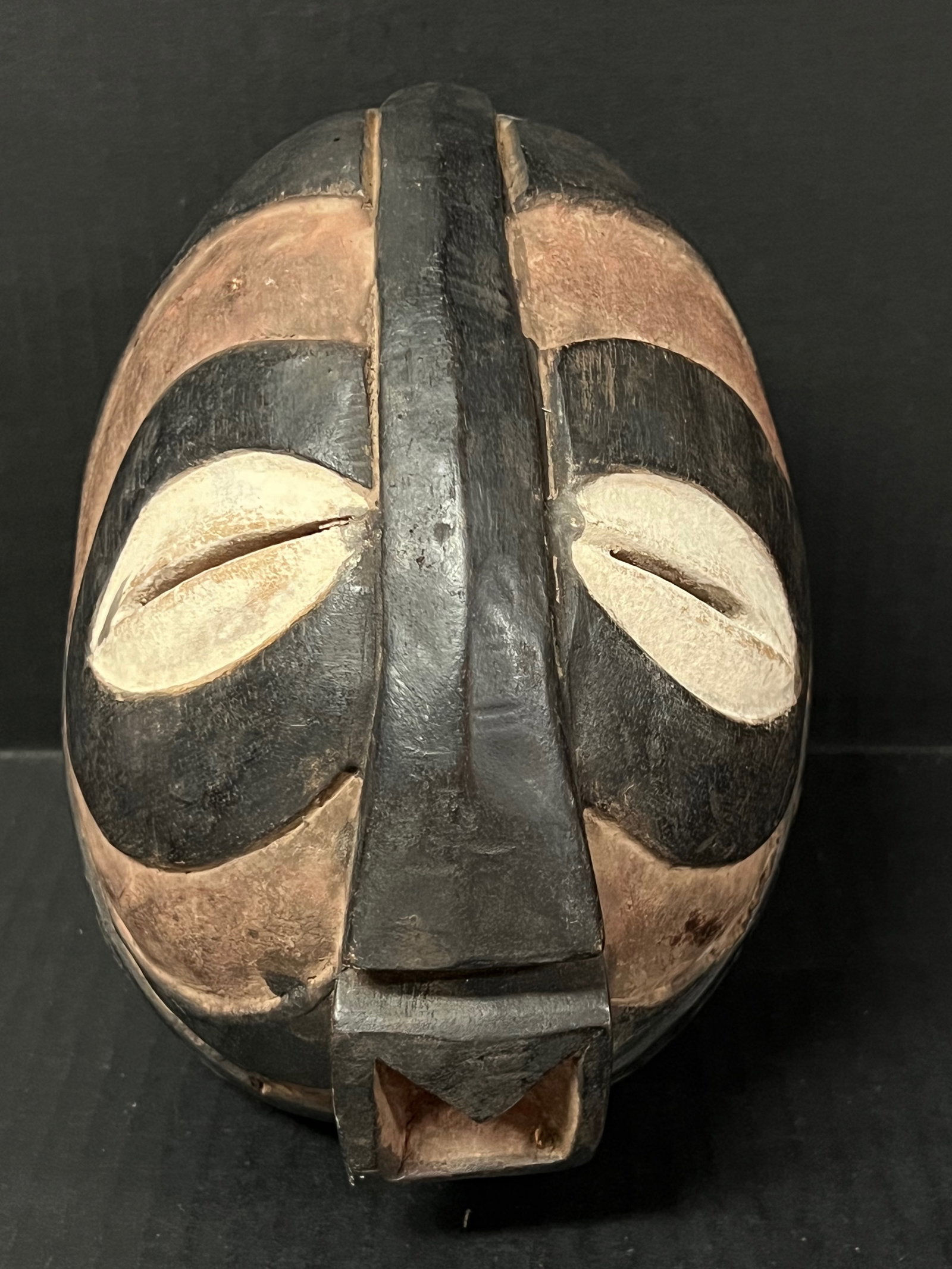 Carved Wood Basongye Mask: African Tribal Art Carved Wood Basongye Mask. The dimension is 8.25 inches high x 6 inches wide. Please be aware that some of the items are vintage, secondhand, old ages, antiques and may have a defec