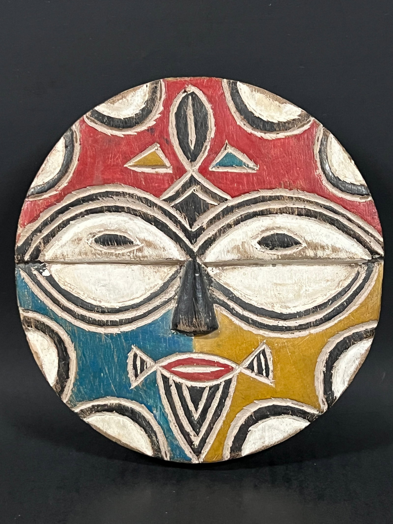 Carved Wood Teke Mask: African Tribal Art Carved Wood Teke Mask. The dimension is 8 inches high x 8 inches wide. Please be aware that some of the items are vintage, secondhand, old ages, antiques and may have a defects or s