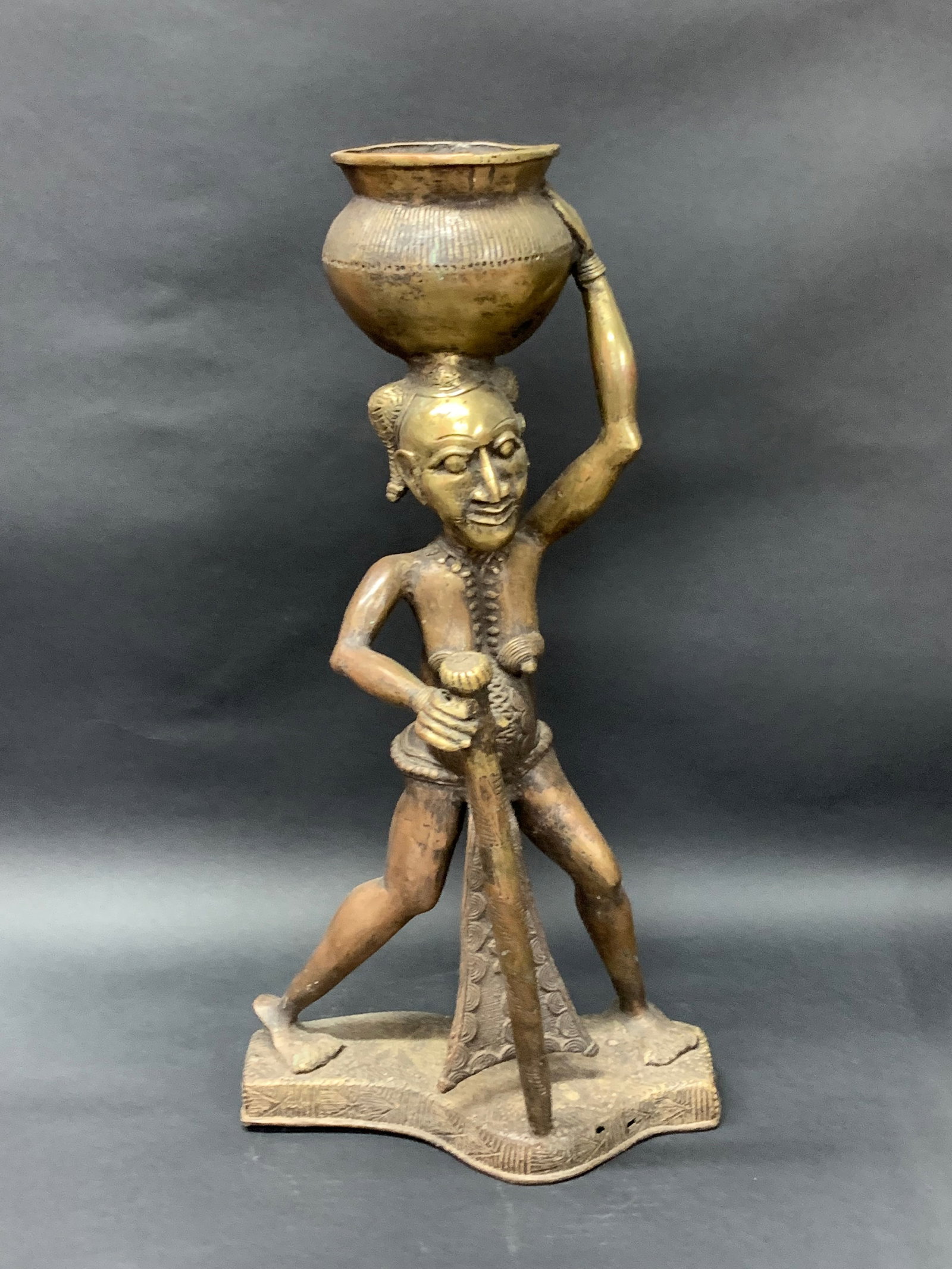 Bronze Bamileke Statue: African Tribal Art Bronze Bamileke Statue. The dimension is 20.5 inches high x 10.5 inches wide. Please be aware that some of the items are vintage, secondhand, old ages, antiques and may have a defec