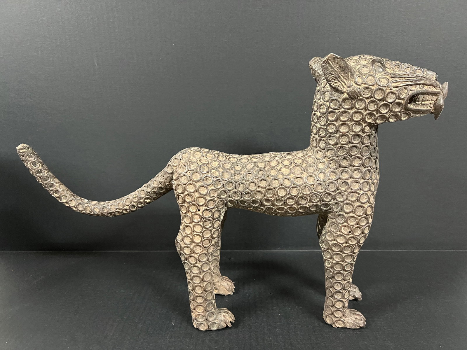 Leopard Bronze Sculpture: African Tribal Art Bronze Leopard Sculpture. The dimension is 13 inches high x 20 inches wide. Please be aware that some of the items are vintage, secondhand, old ages, antiques and may have a defects