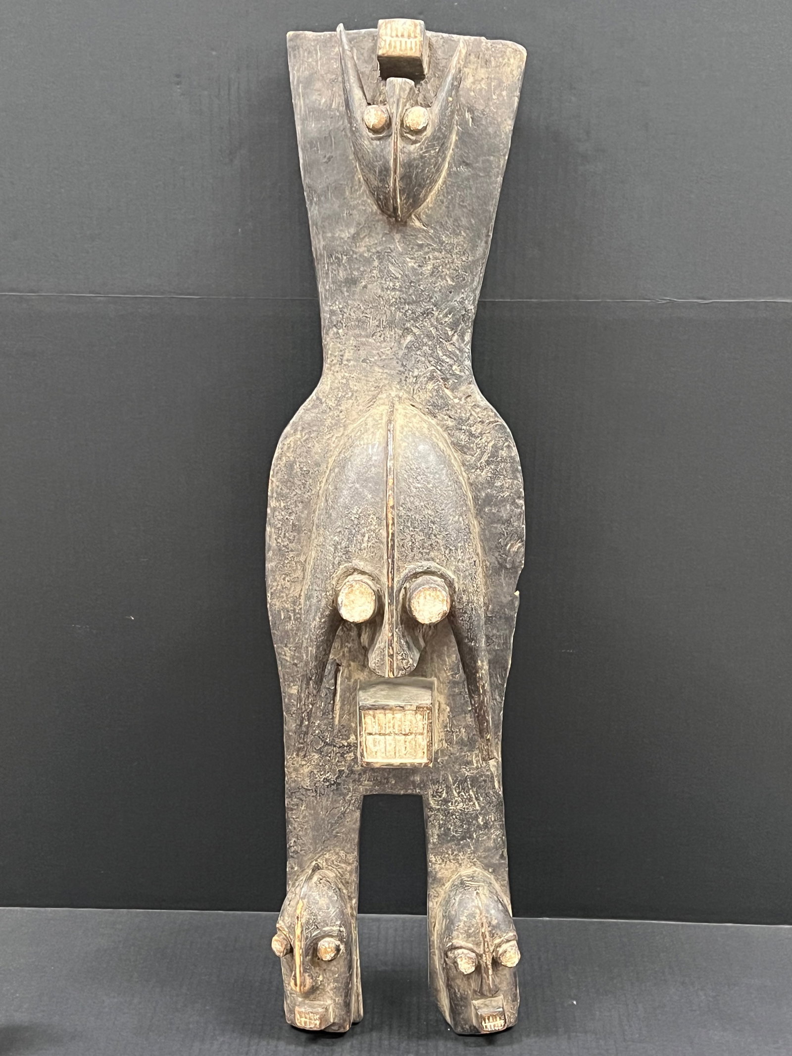 Carved Wood Ijo Mask: African Tribal Art Carved Wood Ijo Mask. The dimension is 33 inches high x 9.5 inches wide. Please be aware that some of the items are vintage, secondhand, old ages, antiques and may have a defects or