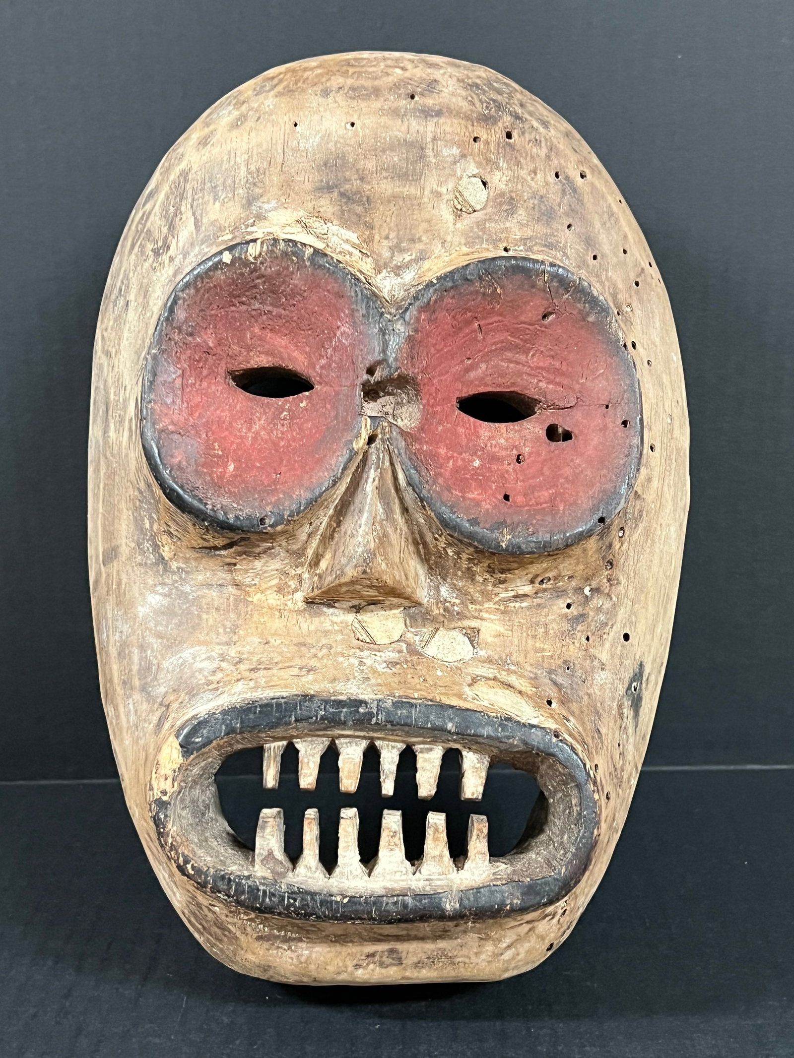 Carved Wood Bembe Mask: African Tribal Art Carved Wood Bembe Mask. The dimension is 12.5 inches high x 8.5 inches wide. Please be aware that some of the items are vintage, secondhand, old ages, antiques and may have a defect
