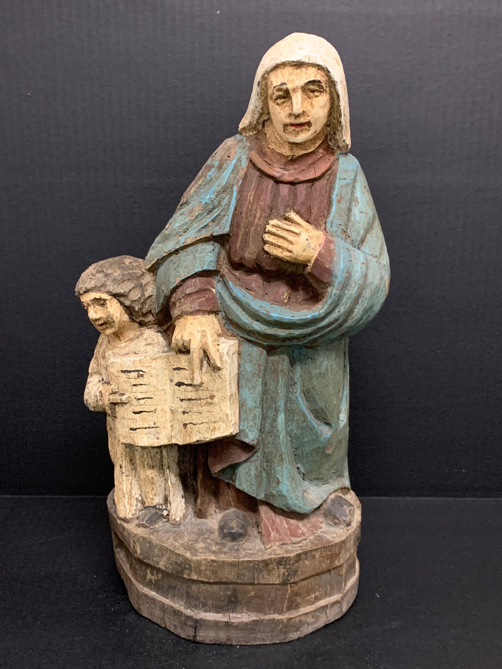 Carved Wood Saint Anne Sculpture: Religious Art Carved Wood Saint Anne Sculpture. The dimension is 16.5 inches high x 7.5 inches wide. Please be aware that some of the items are vintage, secondhand, old ages, antiques and may have a d