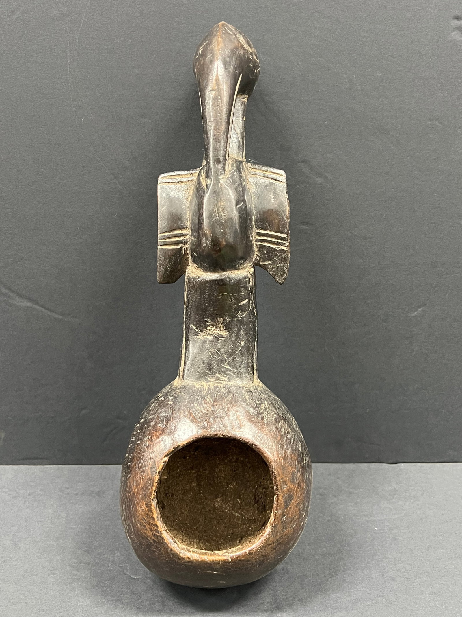 Carved Wood Senufo Spoon: African Tribal Art Carved Wood Senufo Spoon. The dimension is 12.5 inches high x 4.25 inches wide. Please be aware that some of the items are vintage, secondhand, old ages, antiques and may have a