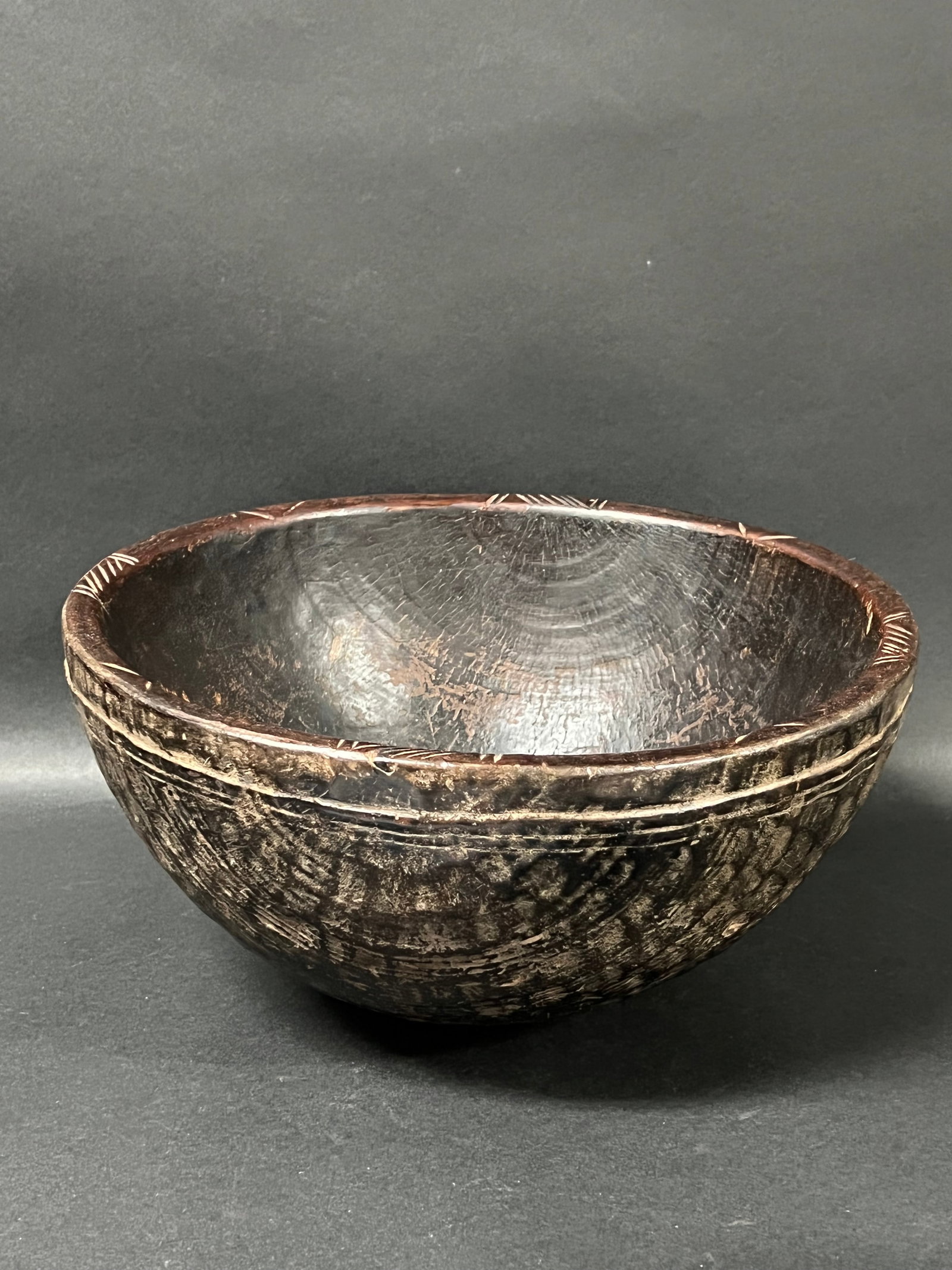 Carved Wood Tanzania Bowl: African Tribal Art Carved Wood Tanzania Bowl. The dimension is 6 inches high x 12 inches wide. Please be aware that some of the items are vintage, secondhand, old ages, antiques and may have a