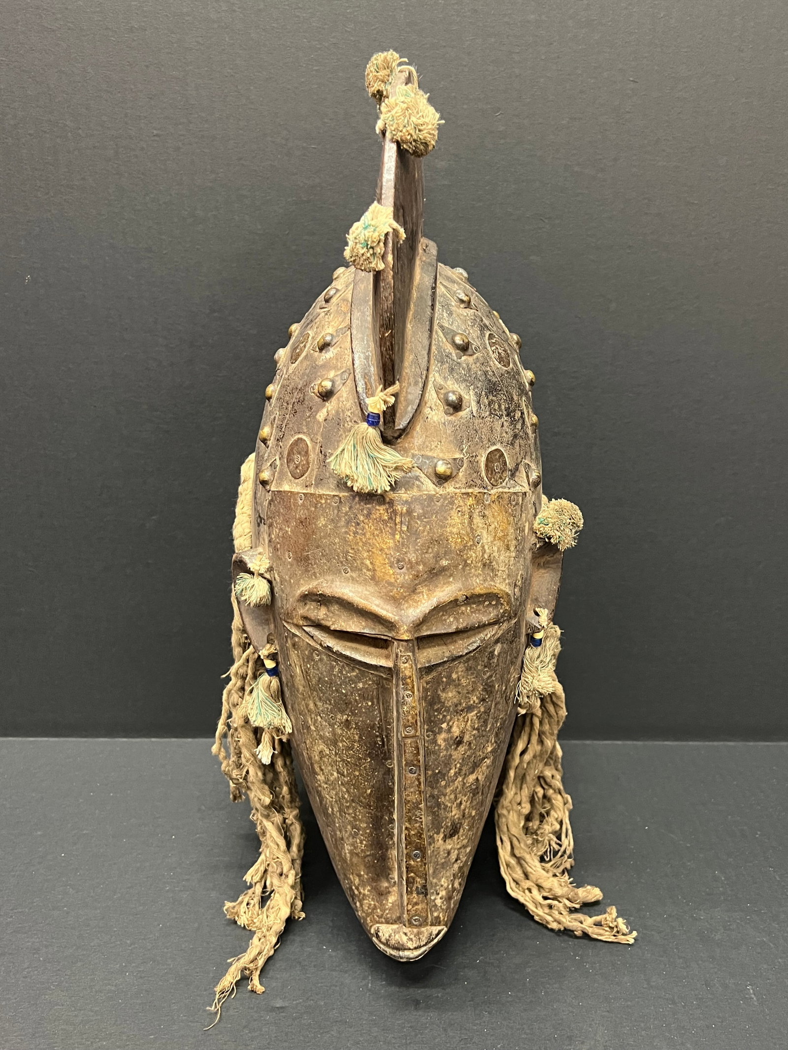 Carved Wood Bamana Helmet mask: African Tribal Art Bamana Helmet Mask. The dimension is 19 inches high x 7 inches wide. Please be aware that some of the items are vintage, secondhand, old ages, antiques and may have a defects or sig