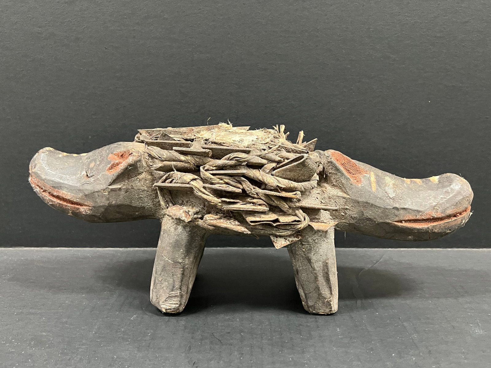 Carved Wood Bacongo Double Head Dog Nail Fetish Sculpture: African Tribal Art Carved Wood Bacongo Double Head Dog Nail Fetish Sculpture. The dimension is 5.5 inches high x 16.5 inches wide. Please be aware that some of the items are vintage, secondhand, old a