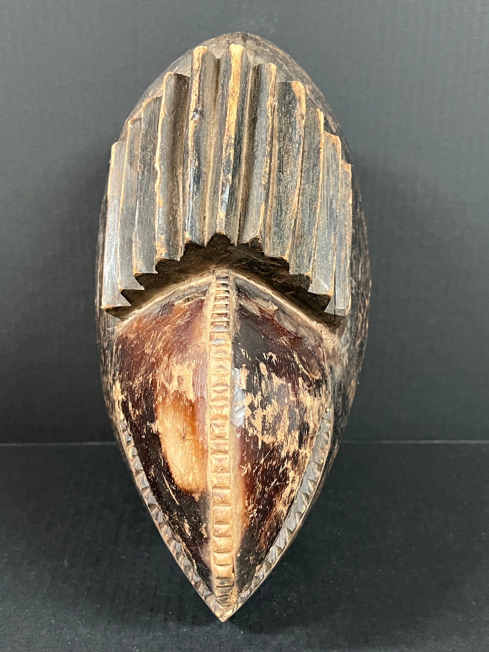 Carved Wood Dan Beak Mask: African Tribal Art Carved Wood Dan Beak Mask. The dimension is 13.5 inches high x 8 inches wide. Please be aware that some of the items are vintage, secondhand, old ages, antiques and may have a defec