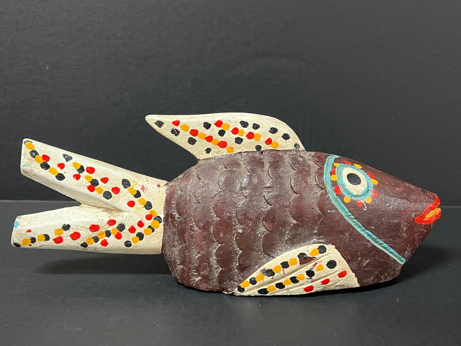 Carved Wood Bozo Puppet Fish: African Tribal Art Carved Wood Bozo Puppet Fish. The dimension is 5.25 inches high x 14.5 inches wide. Please be aware that some of the items are vintage, secondhand, old ages, antiques and may have