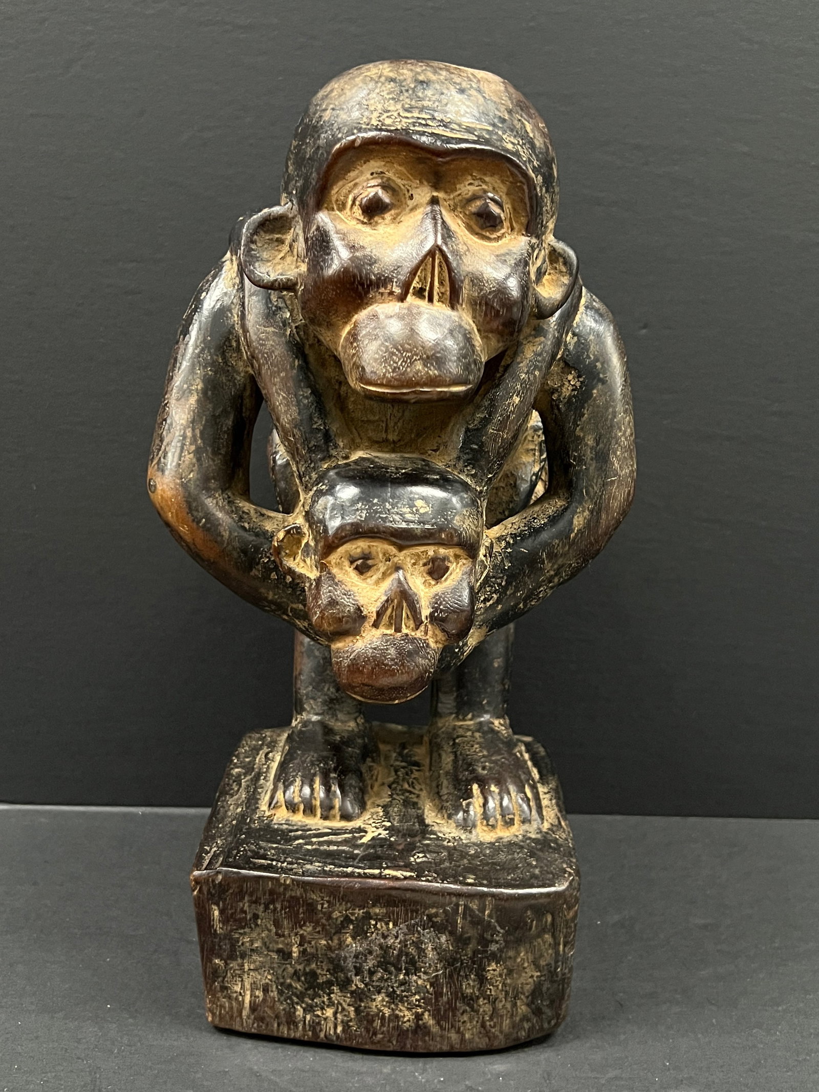 Carved Wood Bulu Monkey Statue: African Tribal Art Carved Wood Bulu Monkey Statue. The dimension is 14 inches high x 7 inches wide. Please be aware that some of the items are vintage, secondhand, old ages, antiques and may have a de