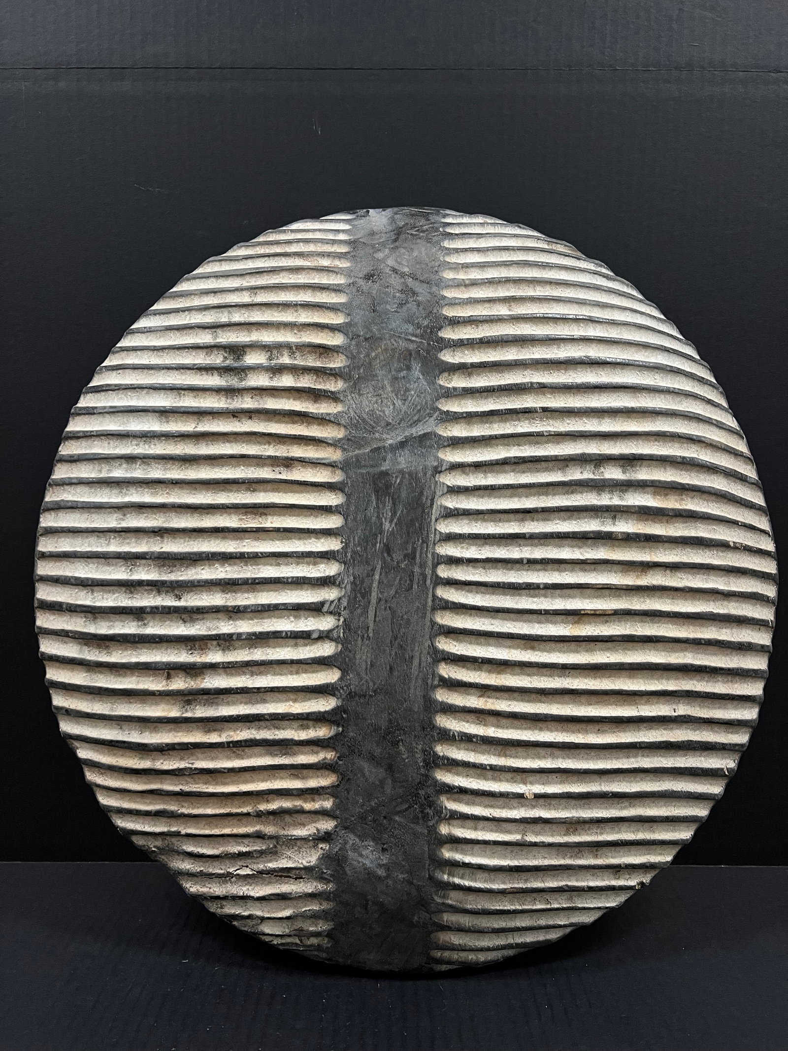 Carved Wood Zulu Shield: African Tribal Art Carved Wood Zulu Shield. The dimension is 21 inches high x 21.5 inches wide. Please be aware that some of the items are vintage, secondhand, old ages, antiques and may have a