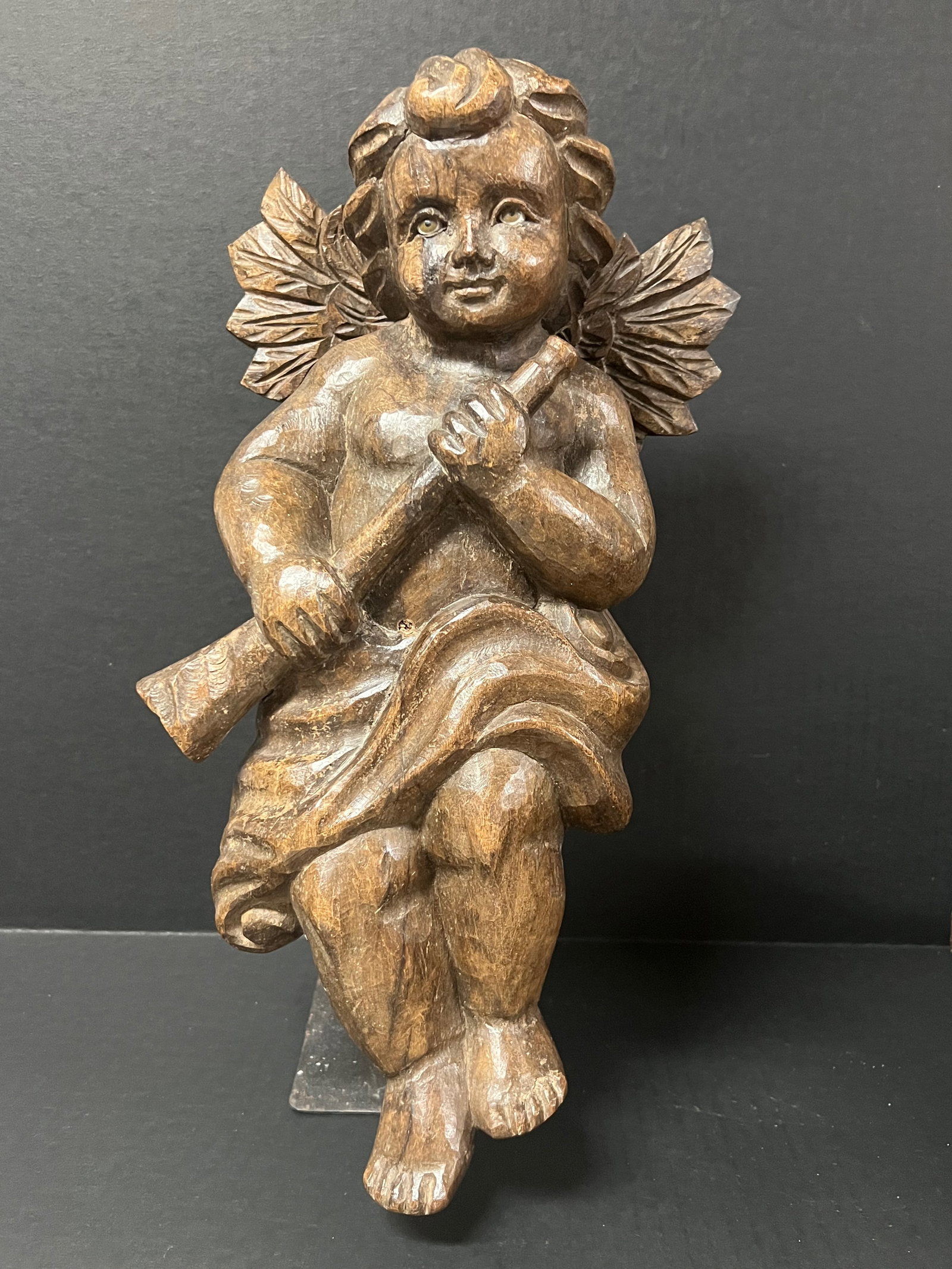 Carved Wood Angel Playing Trumpet: Religious Art Carved Wood Angel Playing Trumpet. The dimension is 15.5 inches high x 7 inches depth x 9 inches wide. Please be aware that some of the items are vintage, secondhand, old ages, antiques 