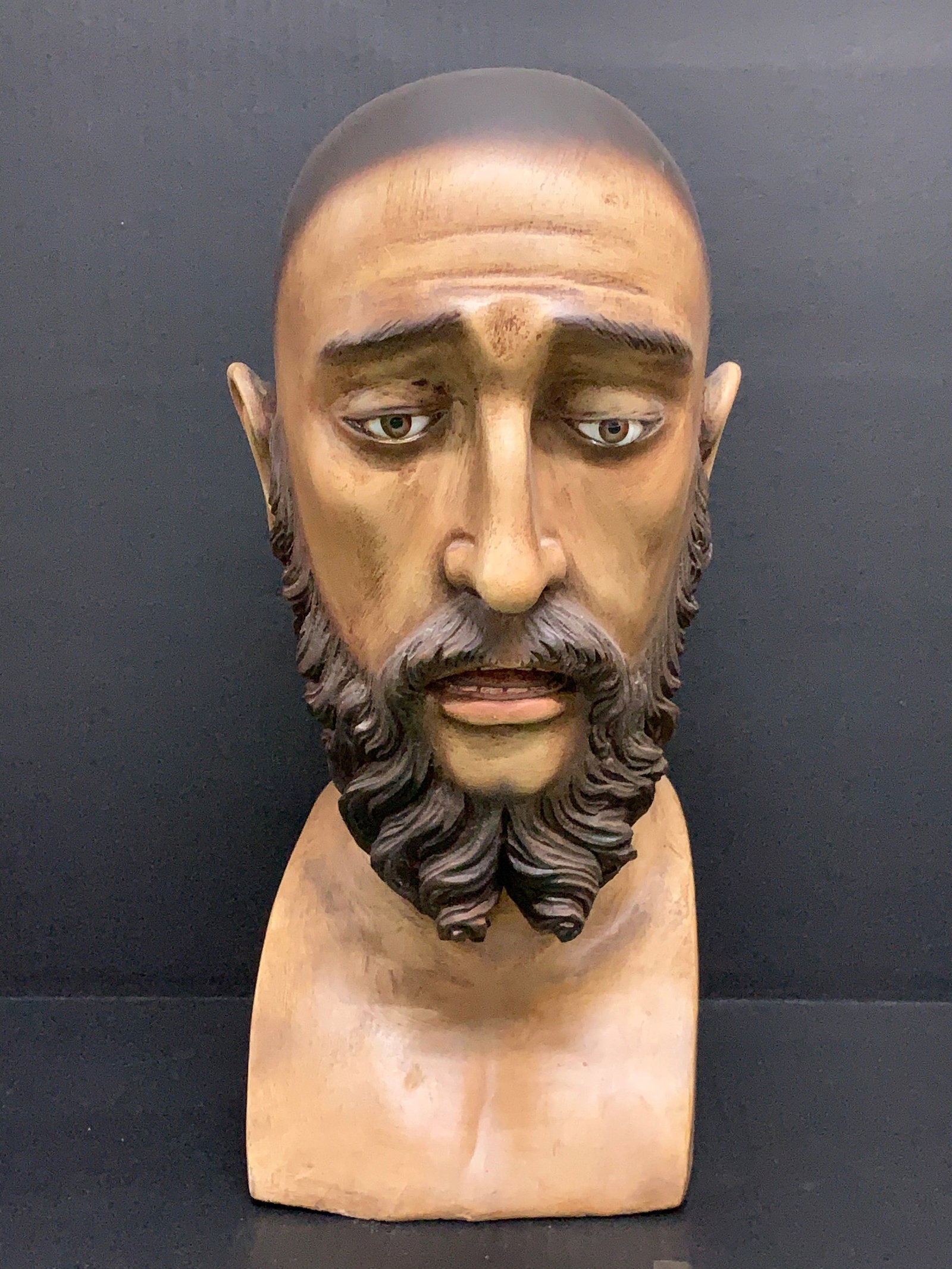 Carved Wood Life Size Head of Saint Joseph with Glass eyes: Religious Art Carved Wood Life Size Head of Saint Joseph. The dimension is 17 inches high x 10 inches depth x 7 inches wide. Please be aware that some of the items are vintage, secondhand, old ages, a